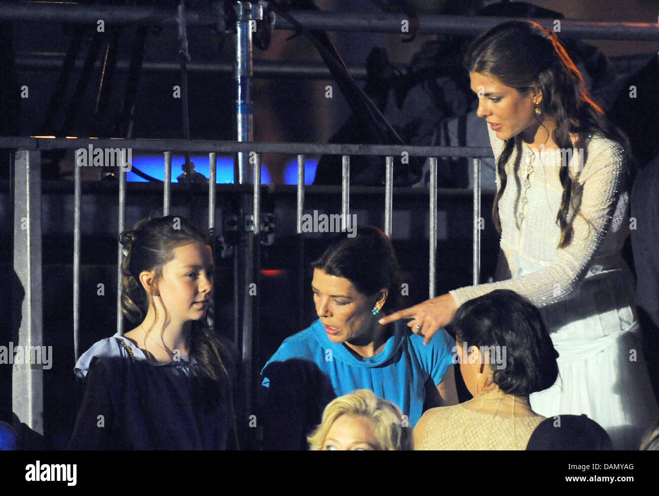 Princess Caroline of Monaco (C) with her daughters Charlotte Casiraghi (r) and Alexandra of Hanover attend a music and light show performed by French composer and musician Jarre to celebrate the royal wedding at Port Hercules, in Monaco, 01 July 2011. Photo: Jochen Lübke dpa Stock Photo