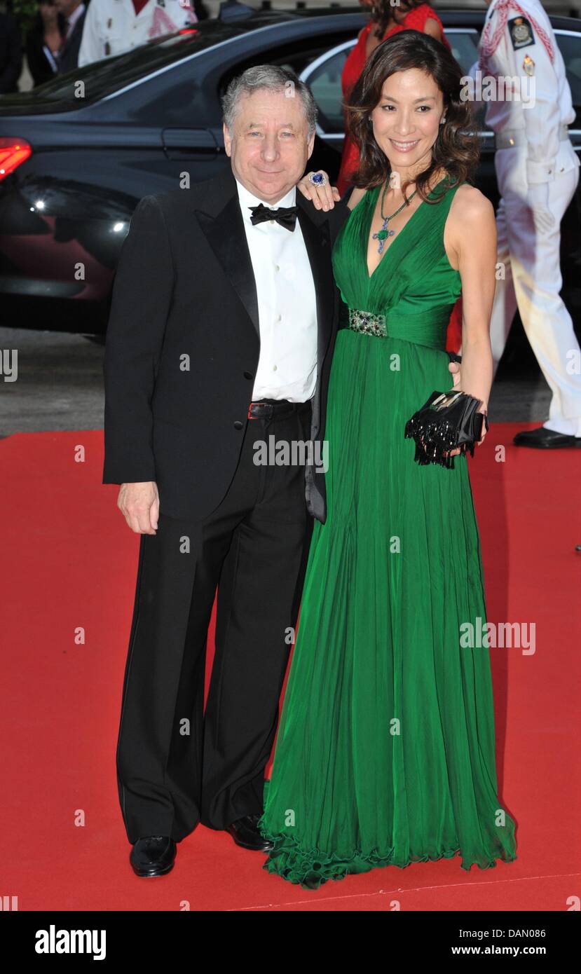 FIA President Jean Todt arrives with his wife Michelle Yeoh for the  official dinner on the Opera terraces after the religious wedding of Prince  Albert II and Princess Charlene of Monaco in