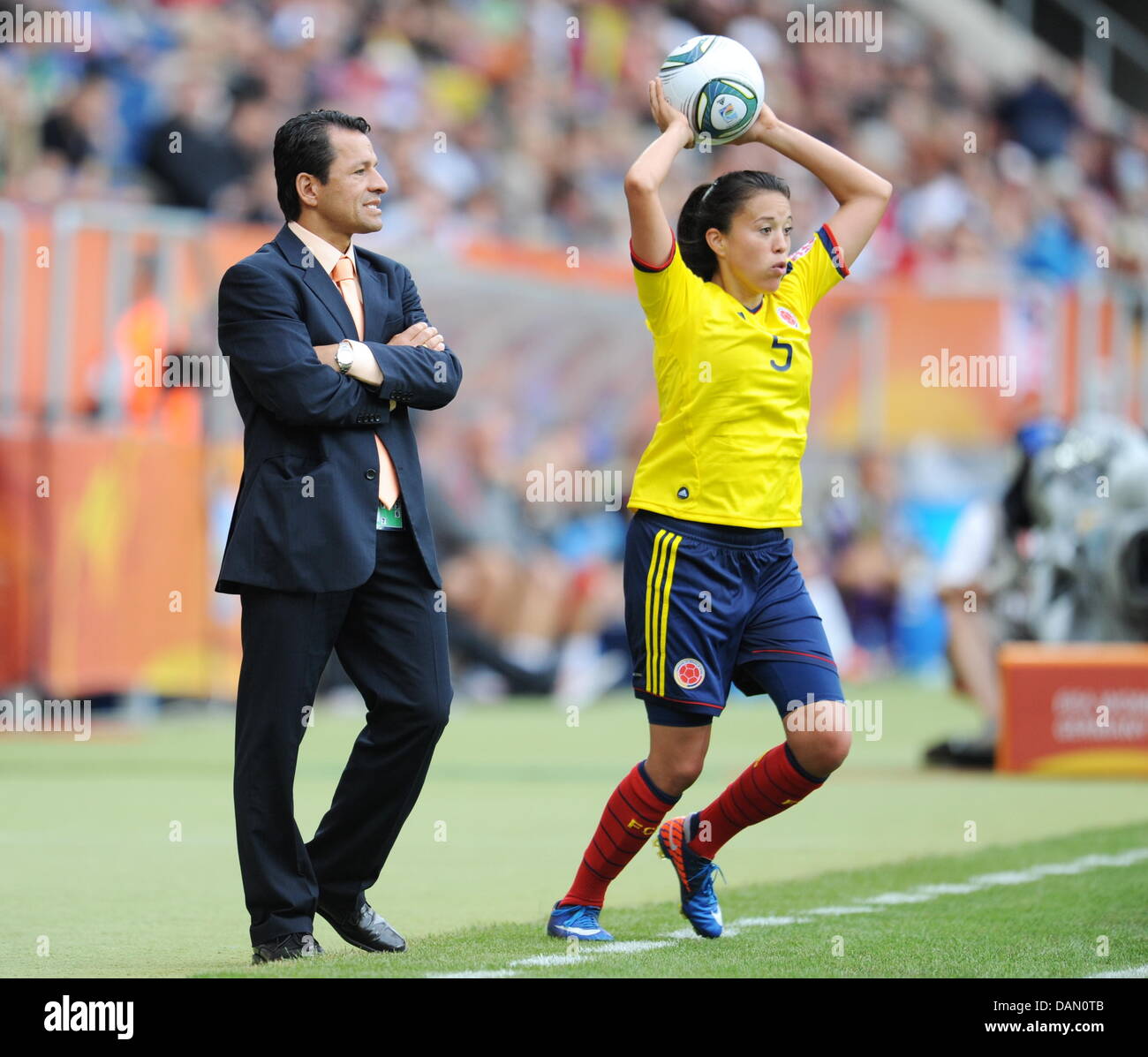 Nataly Arias (r) of Colombia and head coach Ricardo Rozo (l) during the Group C match USA against Colombia of FIFA Women's World Cup soccer tournament at the Rhein Neckar Arena in Sinsheim, Germany, 02 July 2011. USA won the match with 3-0. Foto: Bernd Weißbrod dpa/lsw Stock Photo