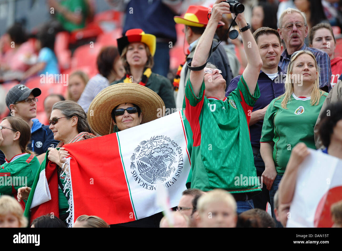 Fans of Mexico's women's national soccer team cheer for their squad
