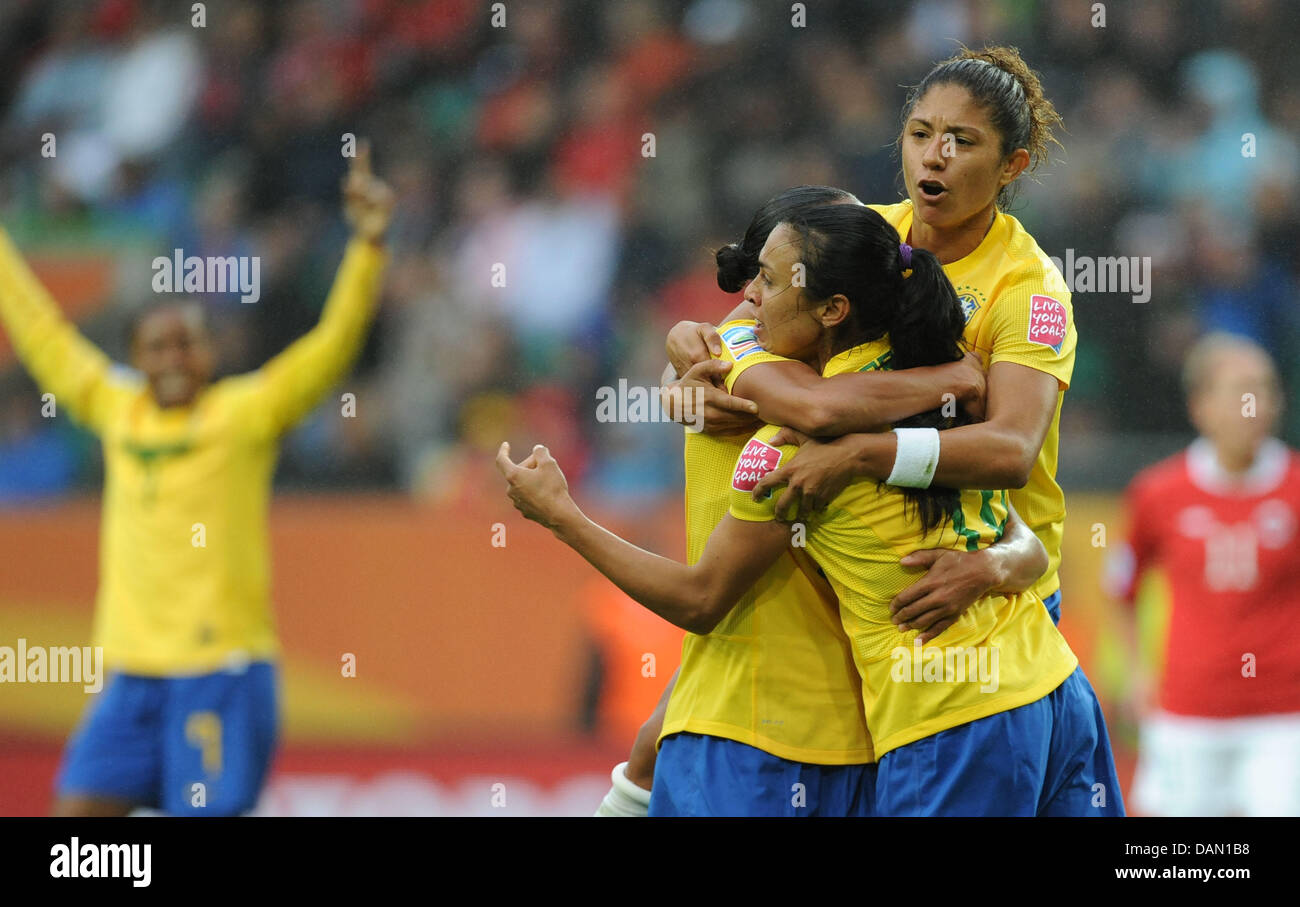 Marta (R) of Brazil celebrates with teammates Rosana (hidden) and Cristiane (top) after scoring 1-0  during their Group D match Brazil against Norway of FIFA Women's World Cup soccer tournament at the Arena Im Allerpark, Wolfsburg, Germany, 03 July 2011. Foto: Peter Steffen dpa/lni  +++(c) dpa - Bildfunk+++ Stock Photo
