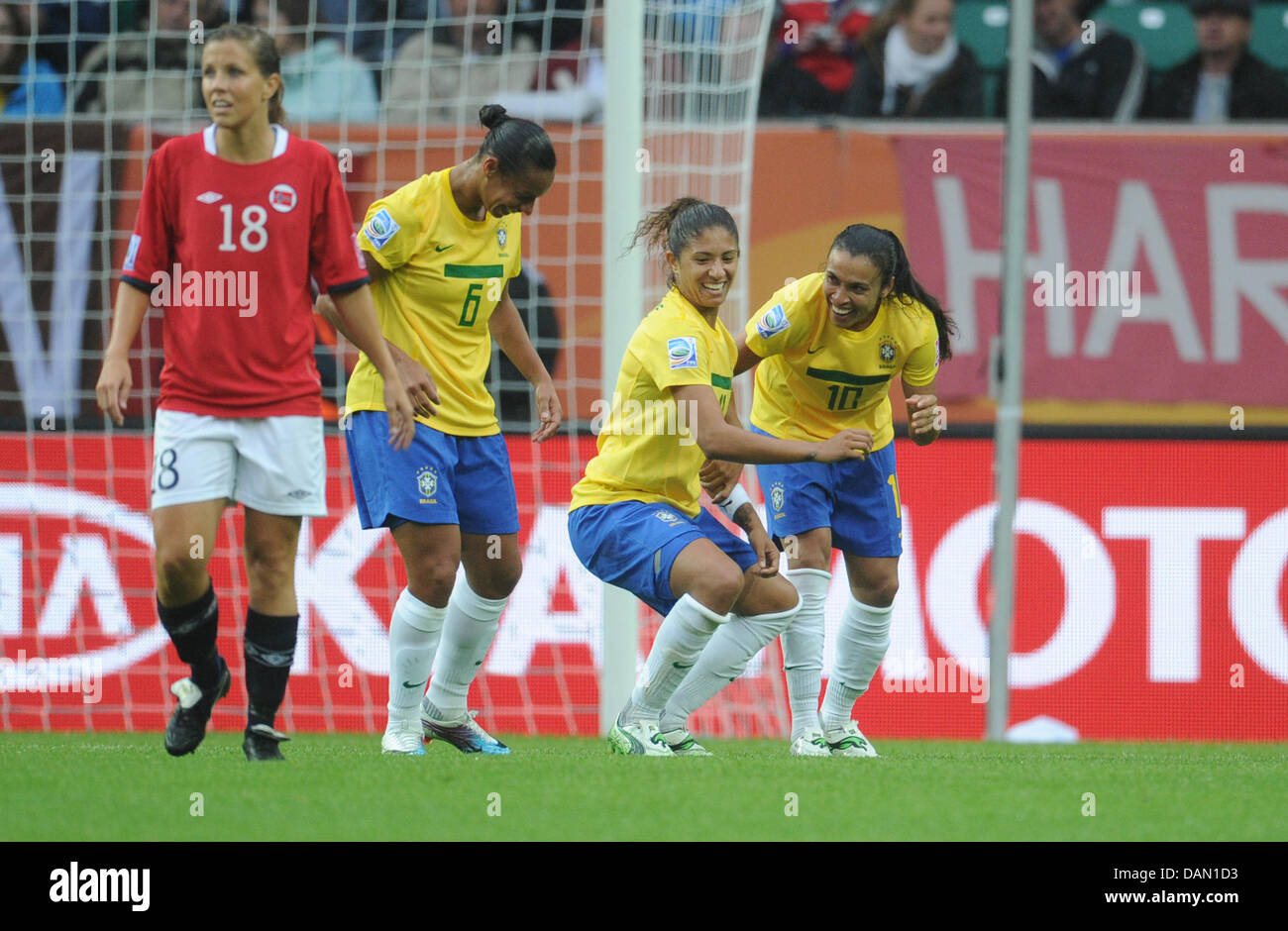 Marta of Brazil (R) celebrates with Rosana (2-L) and Cristiane after scoring 1-0 during the Group D match Brazil against Norway of FIFA Women's World Cup soccer tournament at the Arena Im Allerpark, Wolfsburg, Germany, 03 July 2011. Foto: Julian Stratenschulte dpa/lni  +++(c) dpa - Bildfunk+++ Stock Photo