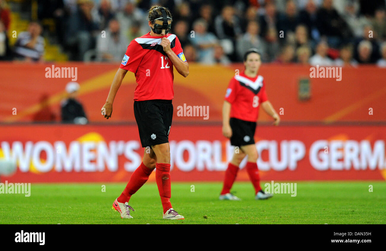 Christine Sinclair (l) of Canada reacts during the Group A match Canada against Nigeria of FIFA Women's World Cup soccer tournament at the Rudolf Harbig Stadium in Dresden, Germany, 05 July 2011. Nigeria won the match with 1-0. Foto: Thomas Eisenhuth dpa/lsn  +++(c) dpa - Bildfunk+++ Stock Photo