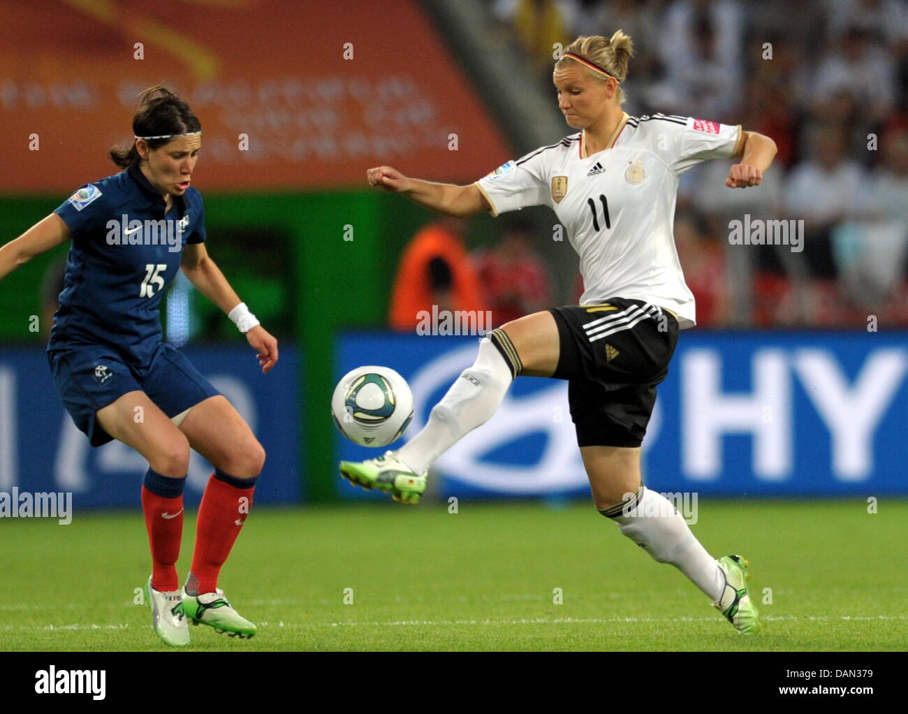 Elise Bussaglia of France and Alexandra Popp (R) of Germany fight for the ball during the Group A match France against Germany of FIFA Women's World Cup soccer tournament at the Borussia Park Stadium in Monchengladbach, Germany, 05 July 2011. Germany won the match with 4-2. Foto: Federico Gambarini dpa/lnw Stock Photo