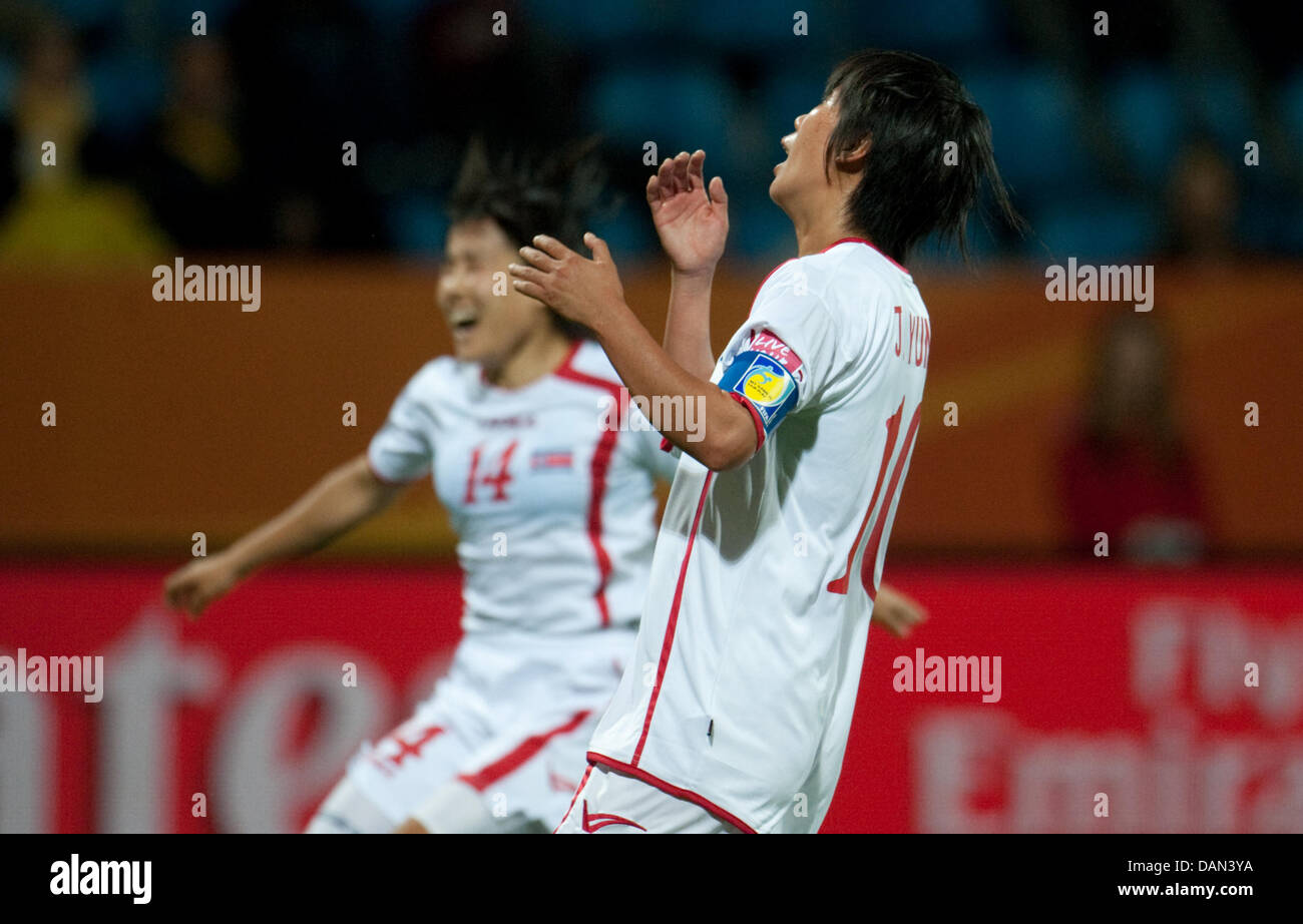 Kim Chung Sim (L) and Jo Yun Mi of North Korea during the Group C match North Korea against Colombia of FIFA Women's World Cup soccer tournament at the FIFA Women's World Cup Stadium in Bochum, Germany, 06 July 2011. Foto: Foto: Bernd Thissen dpa/lnw Stock Photo
