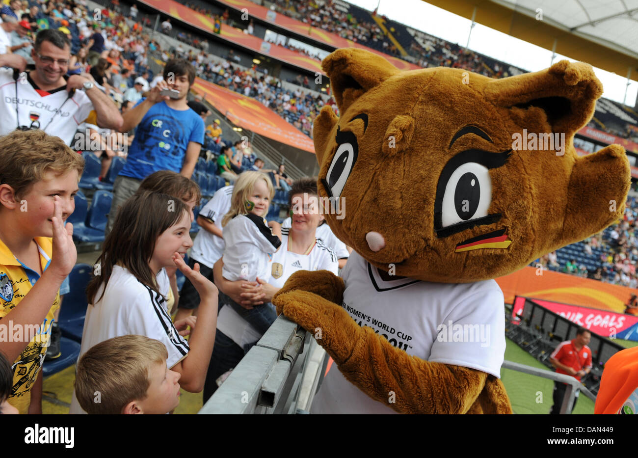World Cup mascot Karla Kick celebrates with young supporters prior to the Group D match Equatorial Guinea against Brazil of FIFA Women's World Cup soccer tournament at the FIFA Women's World Cup Stadium in Frankfurt, Germany, 06 July 2011. Foto: Arne Dedert dpa/lhe Stock Photo
