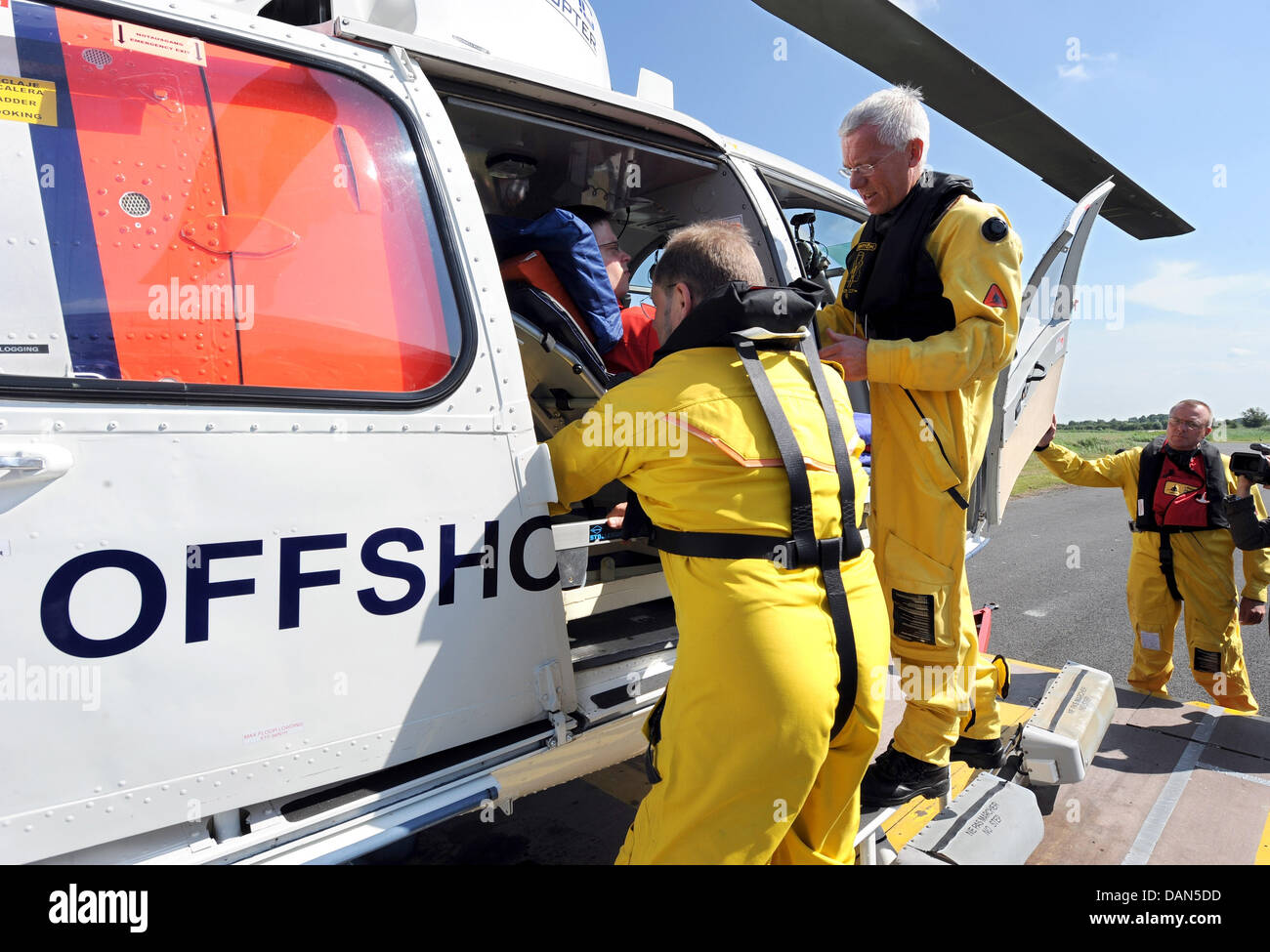A helicopter of the model Eurocopter SA 365, that is specially equipped for offshore rescue missions, is prepared for take off prior to a demonstration flight in Emden, Germany, 08 July 2011. The helicopter is the core element of offshore rescue planning, which is conceptualised by wind turbine manufacturer BARD in collaboration with the German Red Cross and the company Northern He Stock Photo