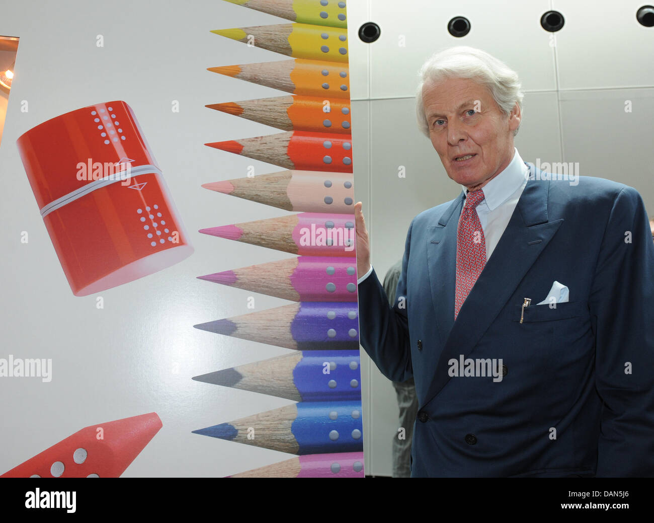 Head of the company Anton Wolfgang Duke of Faber Castell poses next to a picture of pencils after the official ceremony of the 250th anniversary of  the stationery manufacturer Faber-Castell at Franken hall in Nuremberg, Germany, 08 July 2011. Photo: Armin Weigel Stock Photo