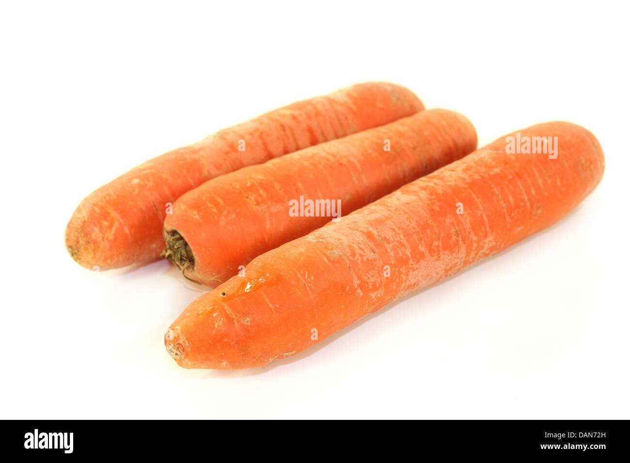 raw carrots in front of white background Stock Photo