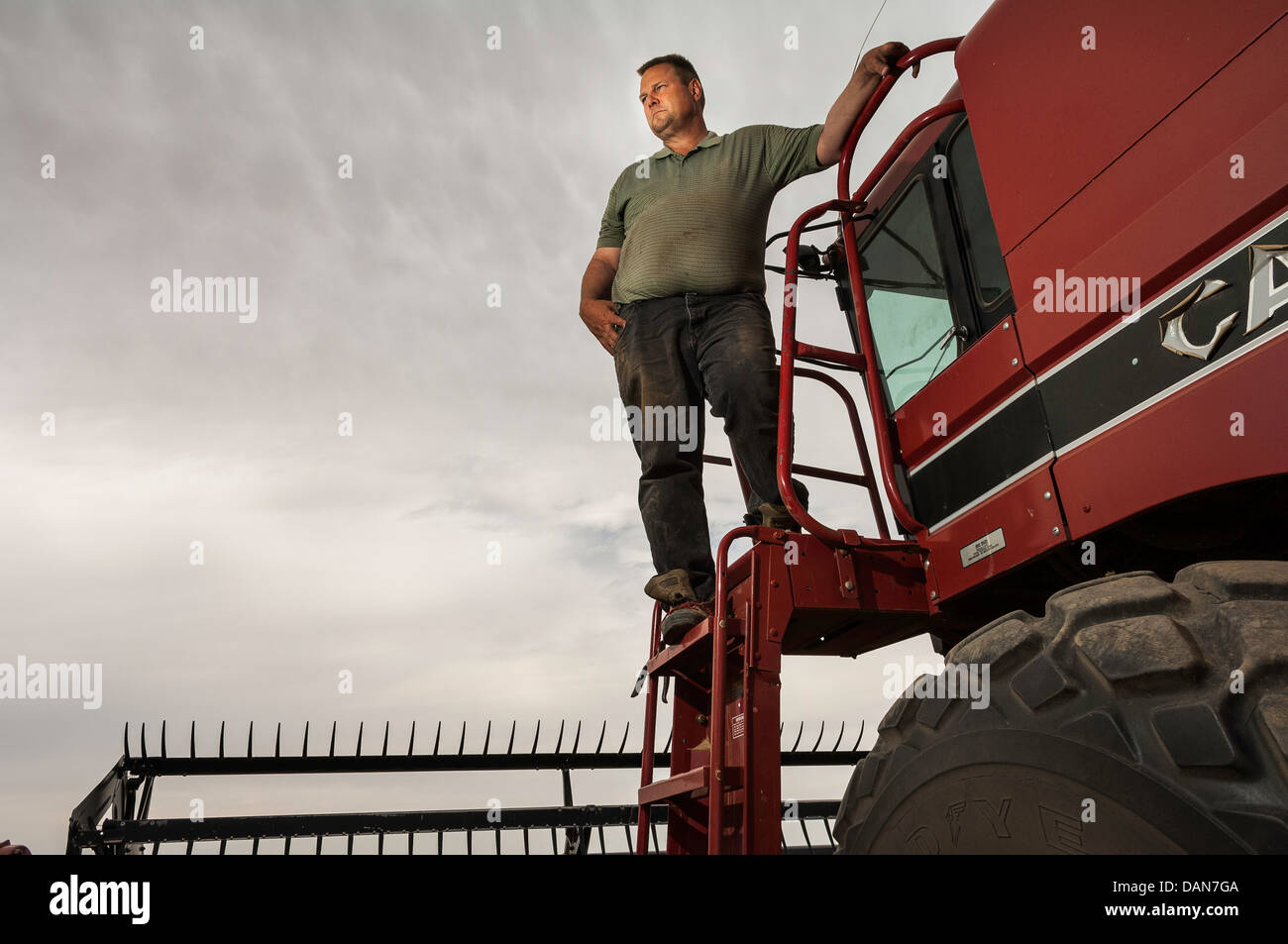 U.S. Sen. Jon Tester, DMont,, poses with his combine on his farm near