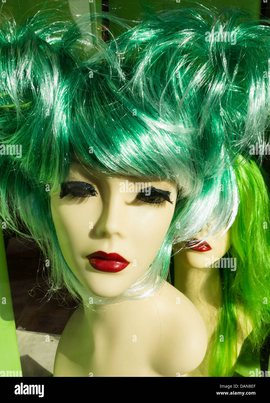 Wig shop display window, NYC Stock Photo