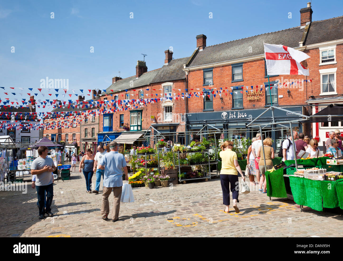 Town centre decked with bunting and market place with stalls Ashbourne Derbyshire England UK GB EU Europe Stock Photo