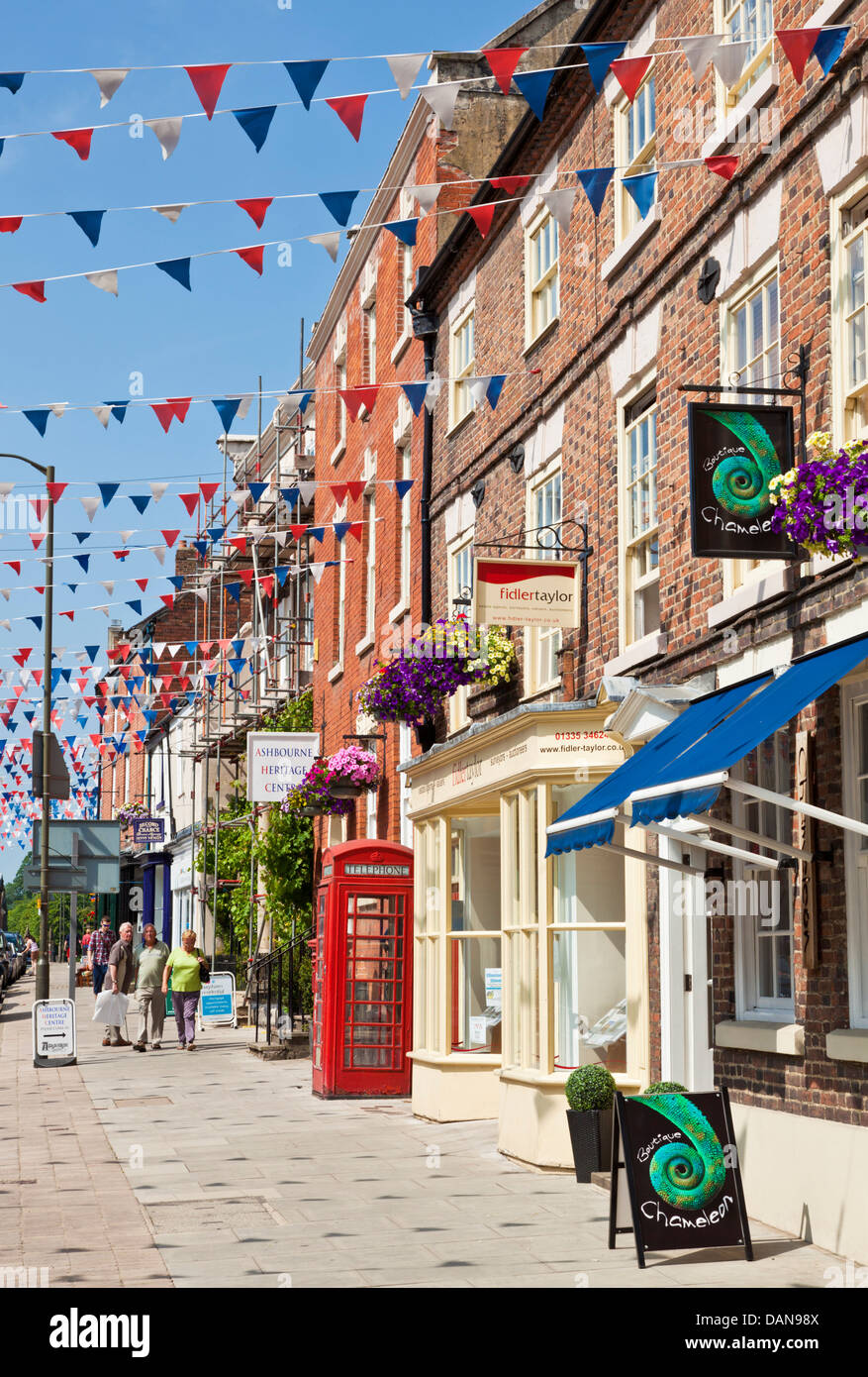 Town centre shopping street decked with bunting  Ashbourne Derbyshire England UK GB EU Europe Stock Photo