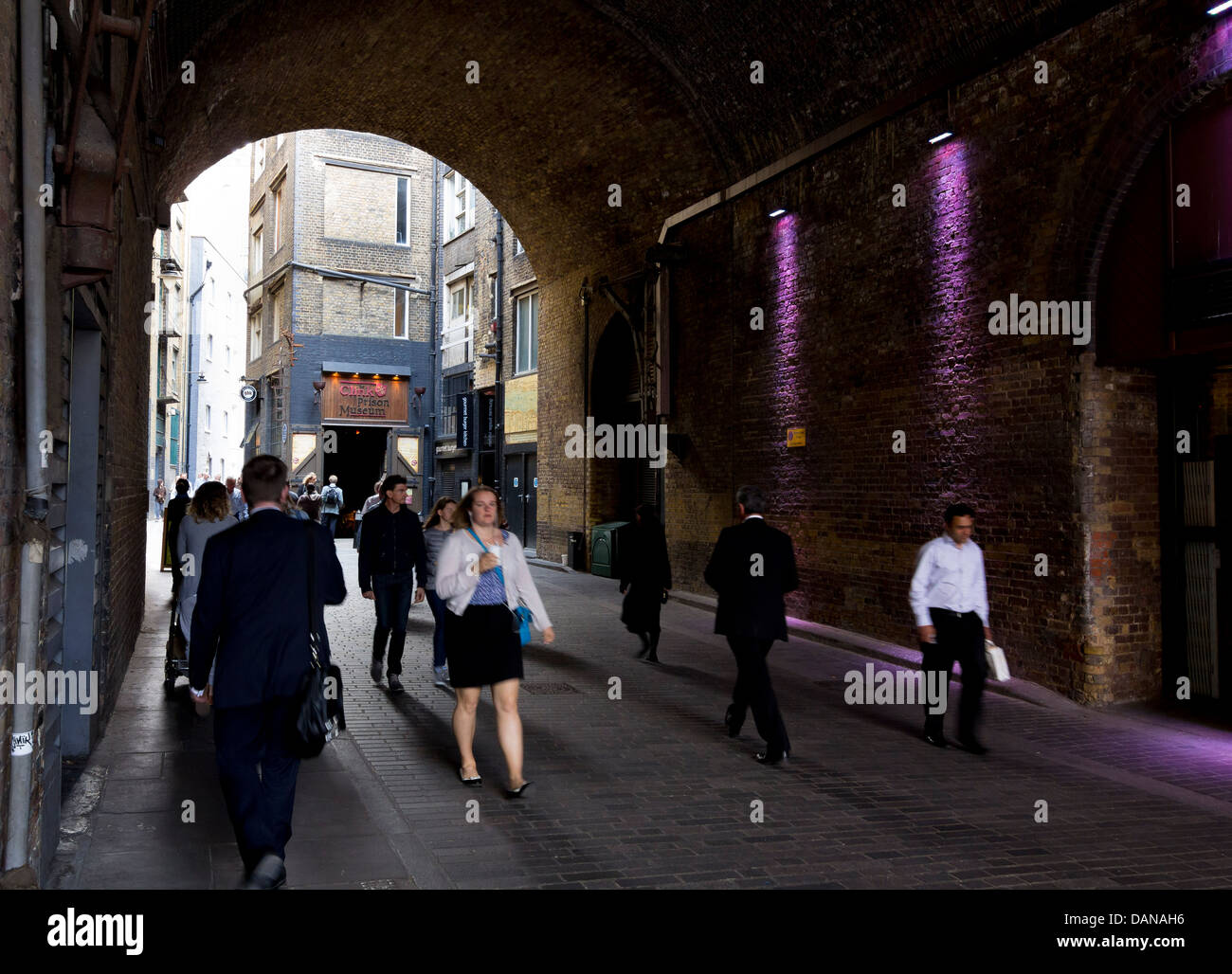 The railway tunnel of the Cannon Street viaduct leading into Clink Street, home of the Clink prison museum. Stock Photo