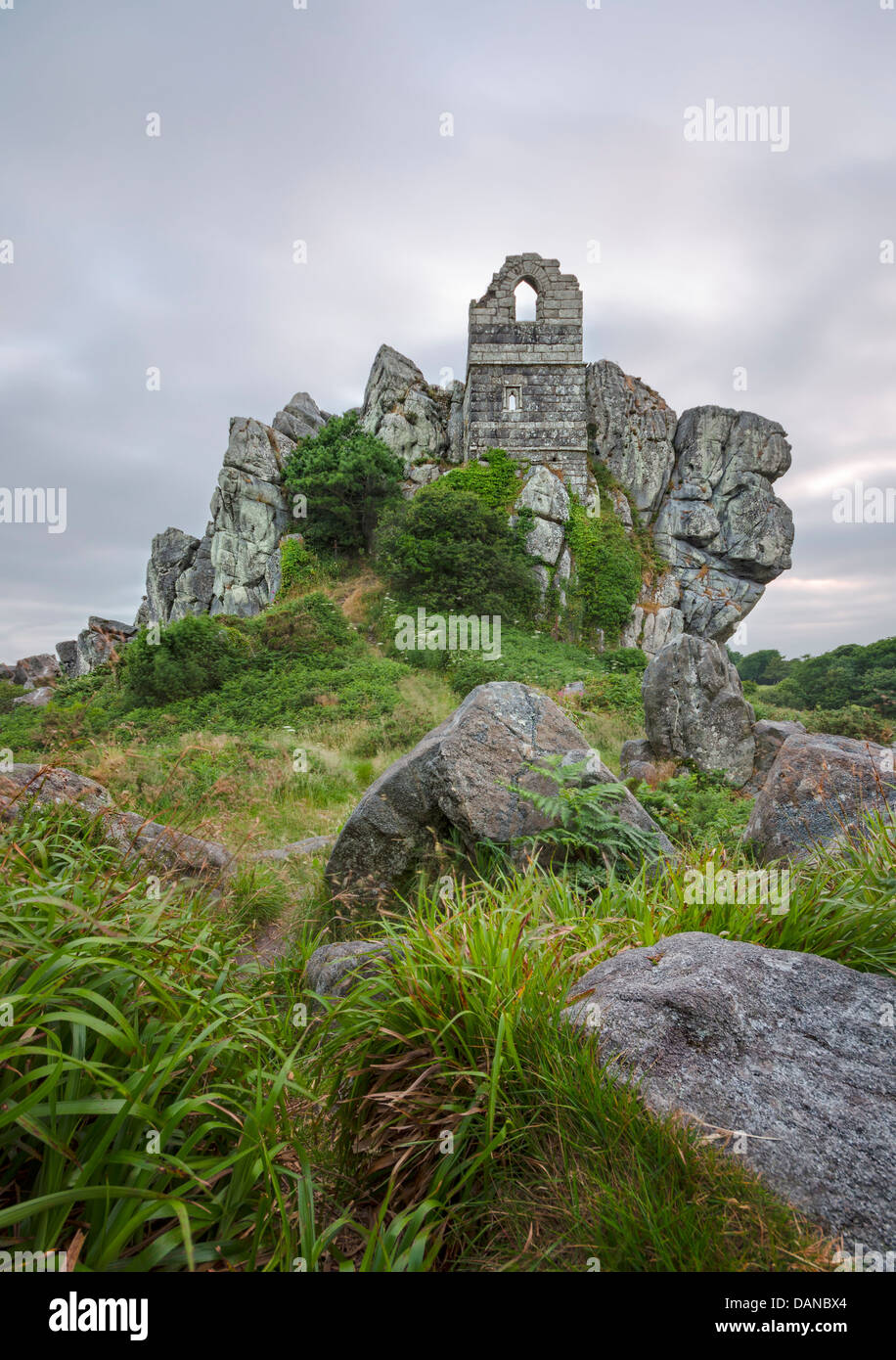 An ancient ruined chapel perched on top of a rocky granite outcrop known as Roche Rock located in mid Cornwall. Stock Photo