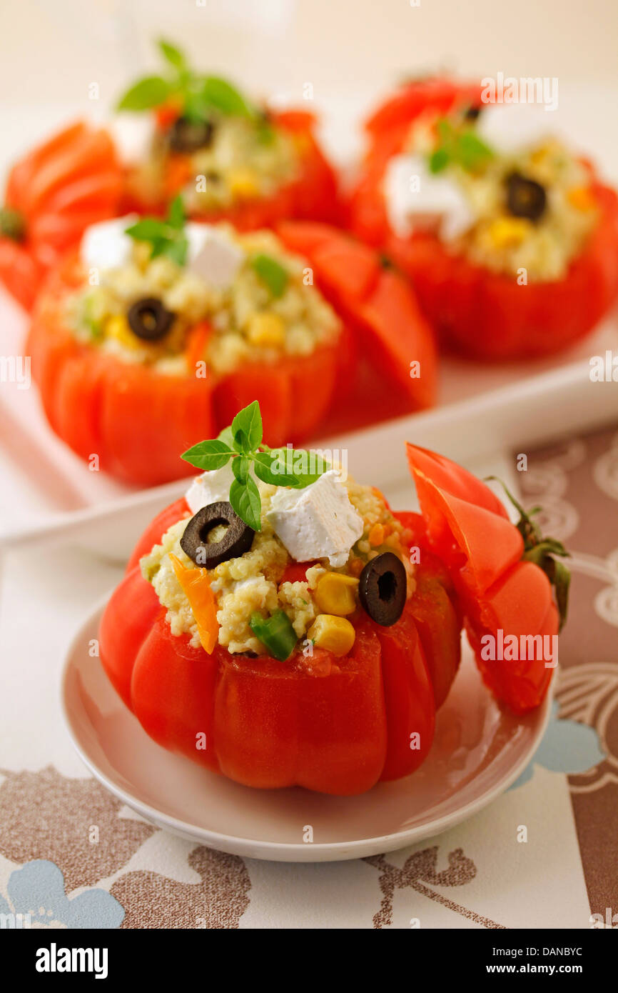 Stuffed tomatoes with millet. Recipe available. Stock Photo