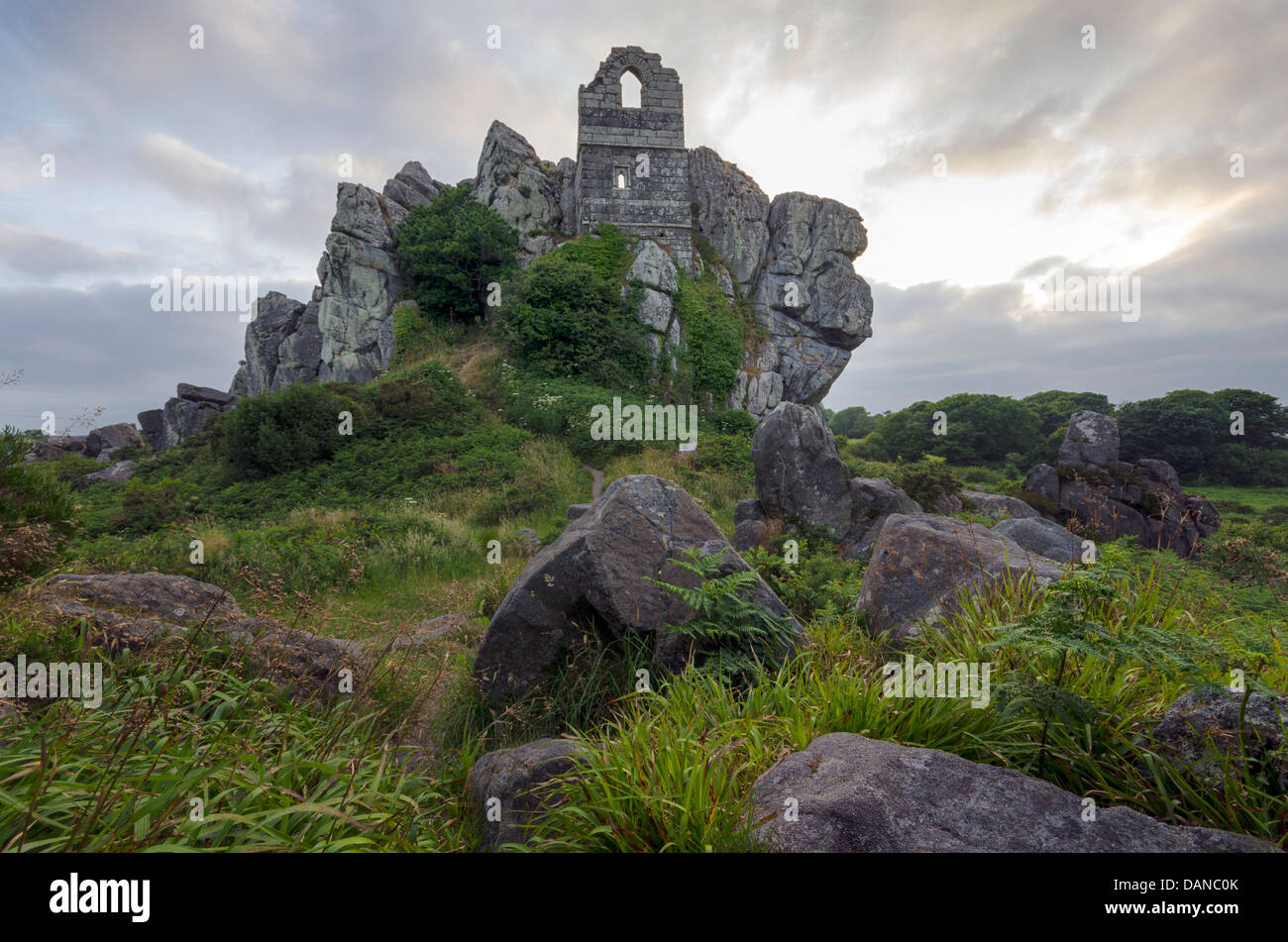 An ancient ruined chapel perched on top of a rocky granite outcrop known as Roche Rock located in mid Cornwall, Stock Photo