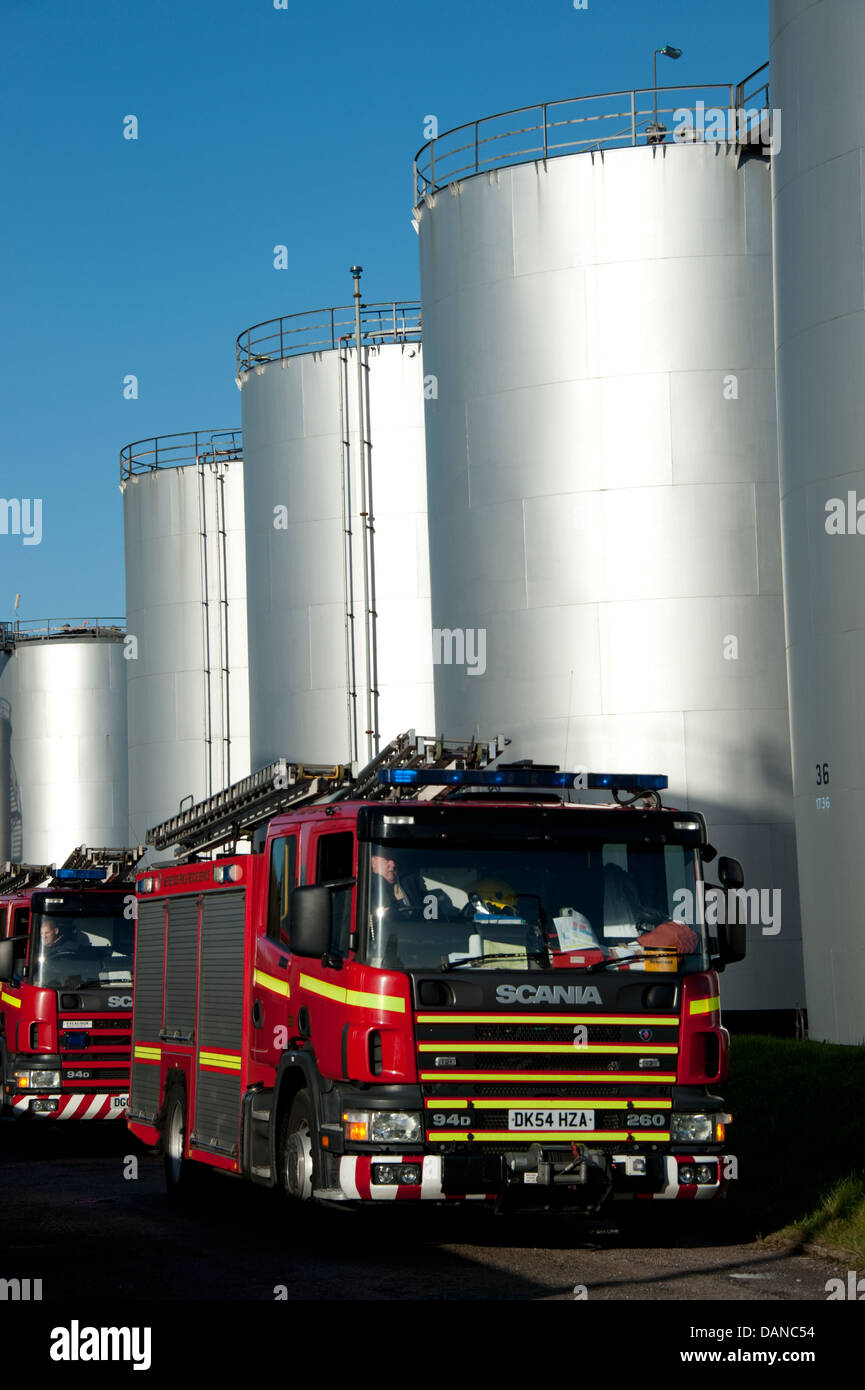 Fire engines at Oil Refinery Storage Tanks Stock Photo