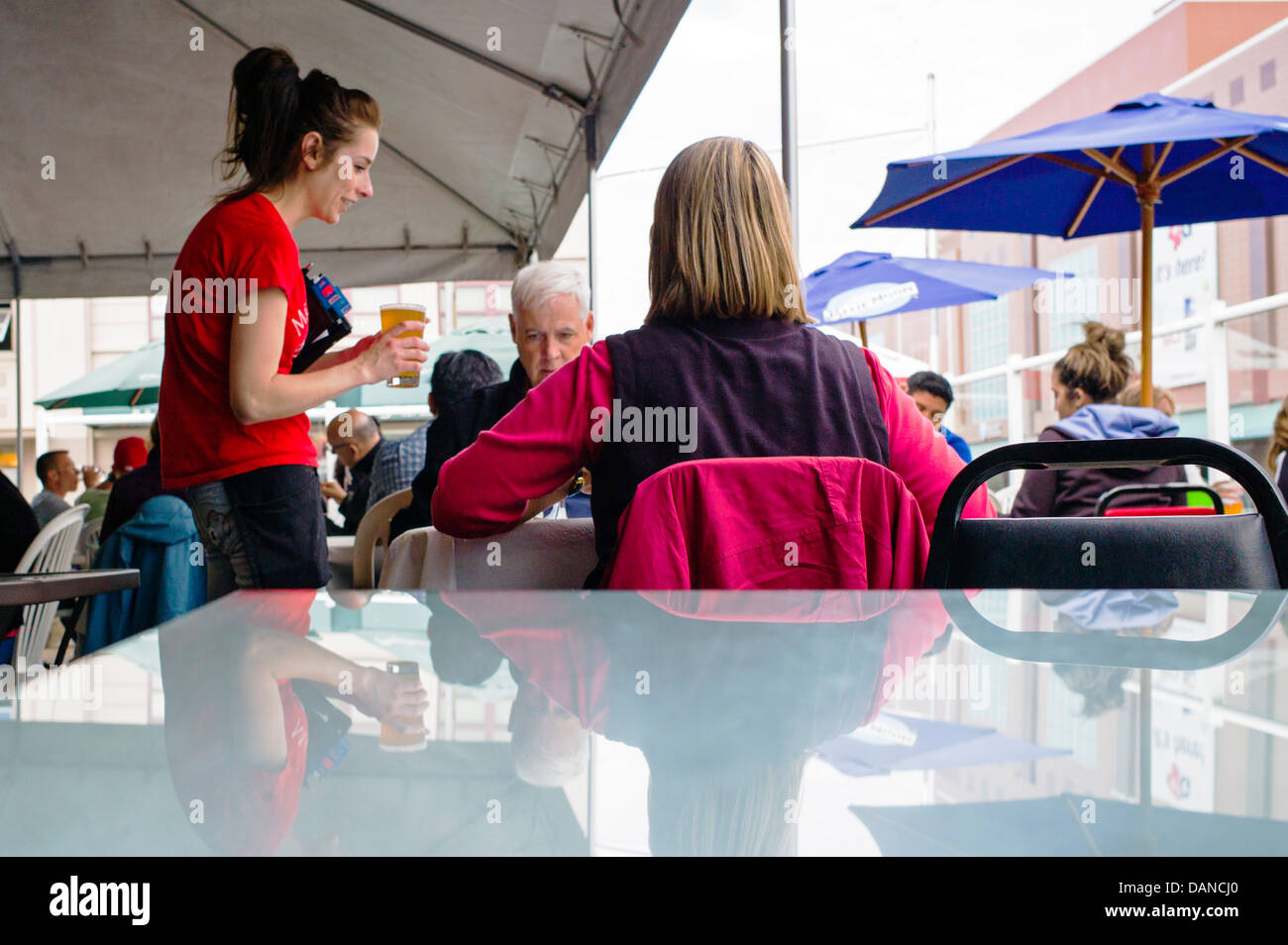 Female server and customers at Phyllis's Cafe and Salmon Bake
