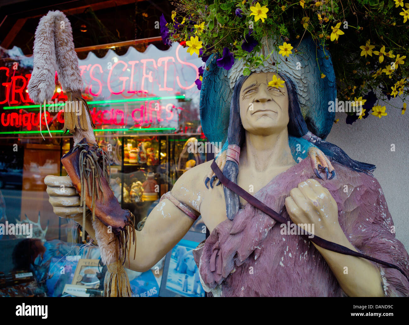 Lifesize statues of Native American Indians decorate the Grizzly's Unique Alaskan Gifts store, Anchorage, Alaska, USA Stock Photo