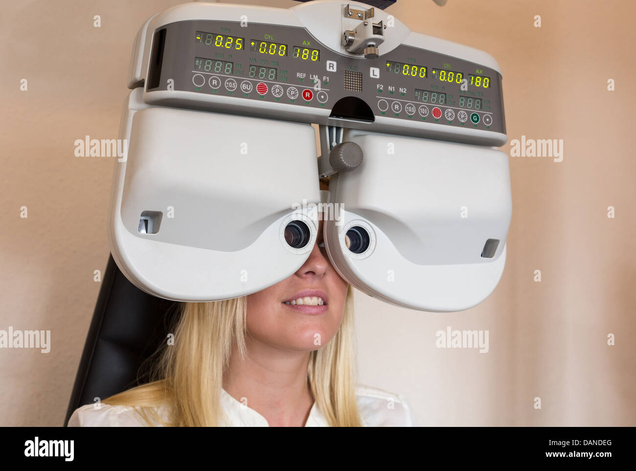 Customer of a optometrist or optician looking through phoropter to determine the right glasses Stock Photo