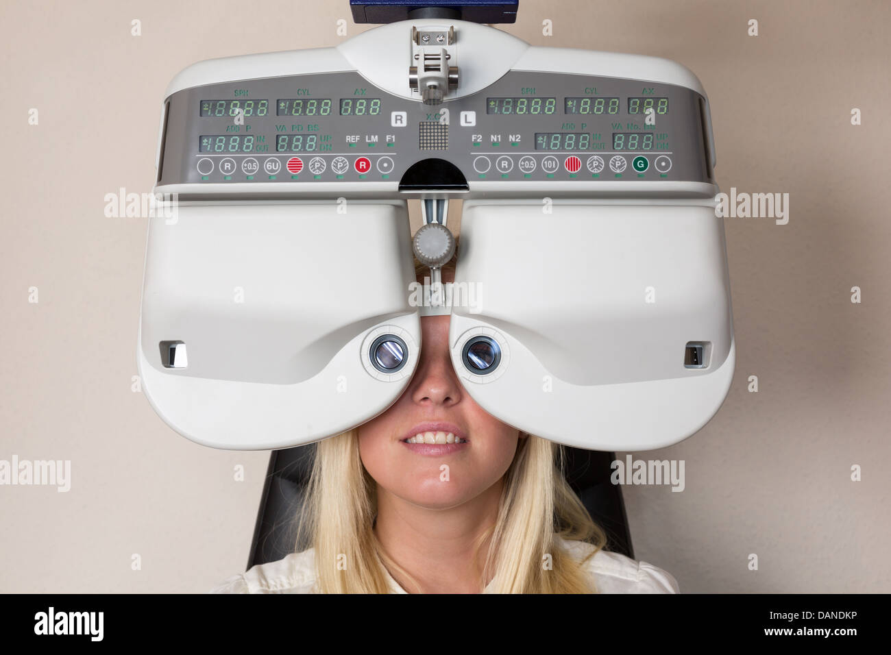 Customer of a optometrist or optician looking through phoropter to determine the right glasses Stock Photo