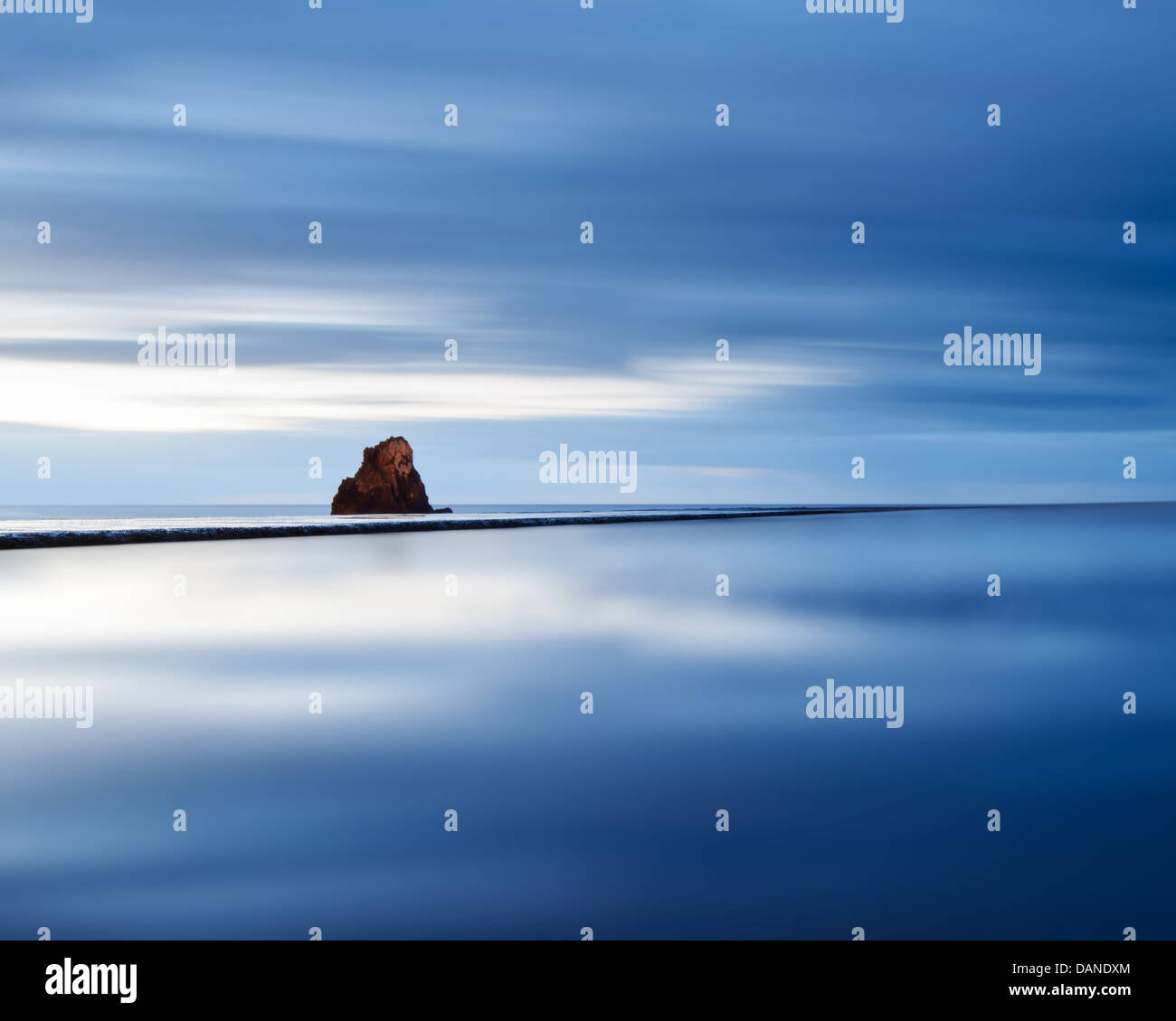 Calm blue sea with rock on horizon, Funchal, Madeira, Portugal Stock Photo