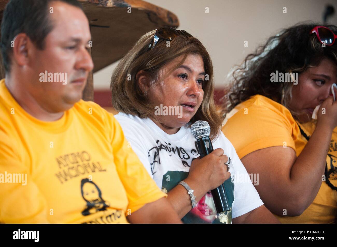 July 16, 2013 - Tucson, Arizona, United States - GUADALUPE GUERRERO, the mother of a  C. Lamadrid, a 19-year-old U.S. citizen shot in the back three times by U.S. Border Patrol agents in 2011, cries while talking about violence on the border.  Eight Tucsonans will spend the next five days fasting as a protest against alleged police collaboration with U.S. Border Patrol, migrant deaths in the desert and the militarization of the border.  The group gathered at a Tucson, Ariz. church to make the announcement. (Credit Image: © Will Seberger/ZUMAPRESS.com) Stock Photo