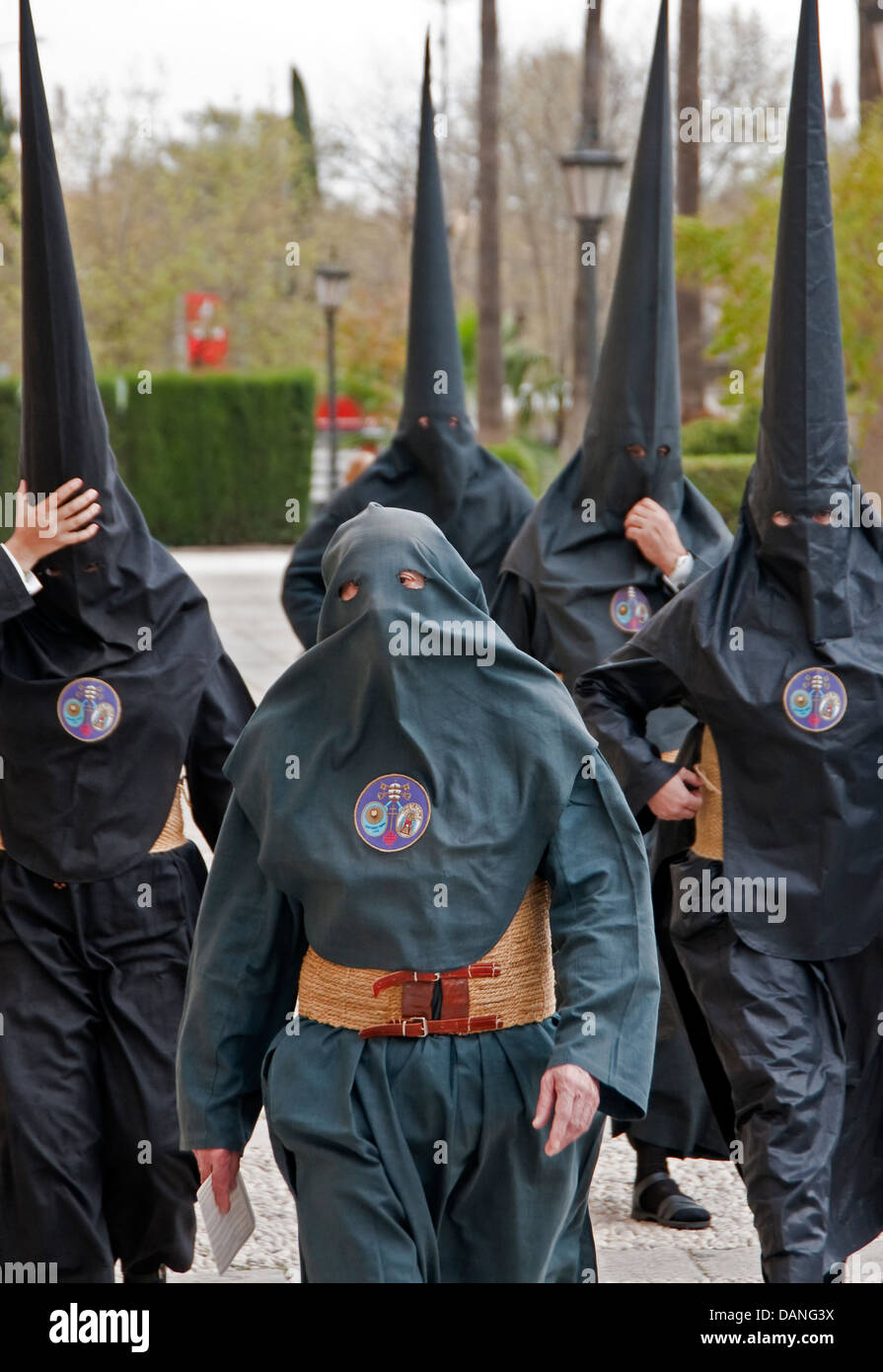 Semana Santa, (holy week) penitents (nazerenos) wearing robes and hoods in Seville, Spain. Stock Photo