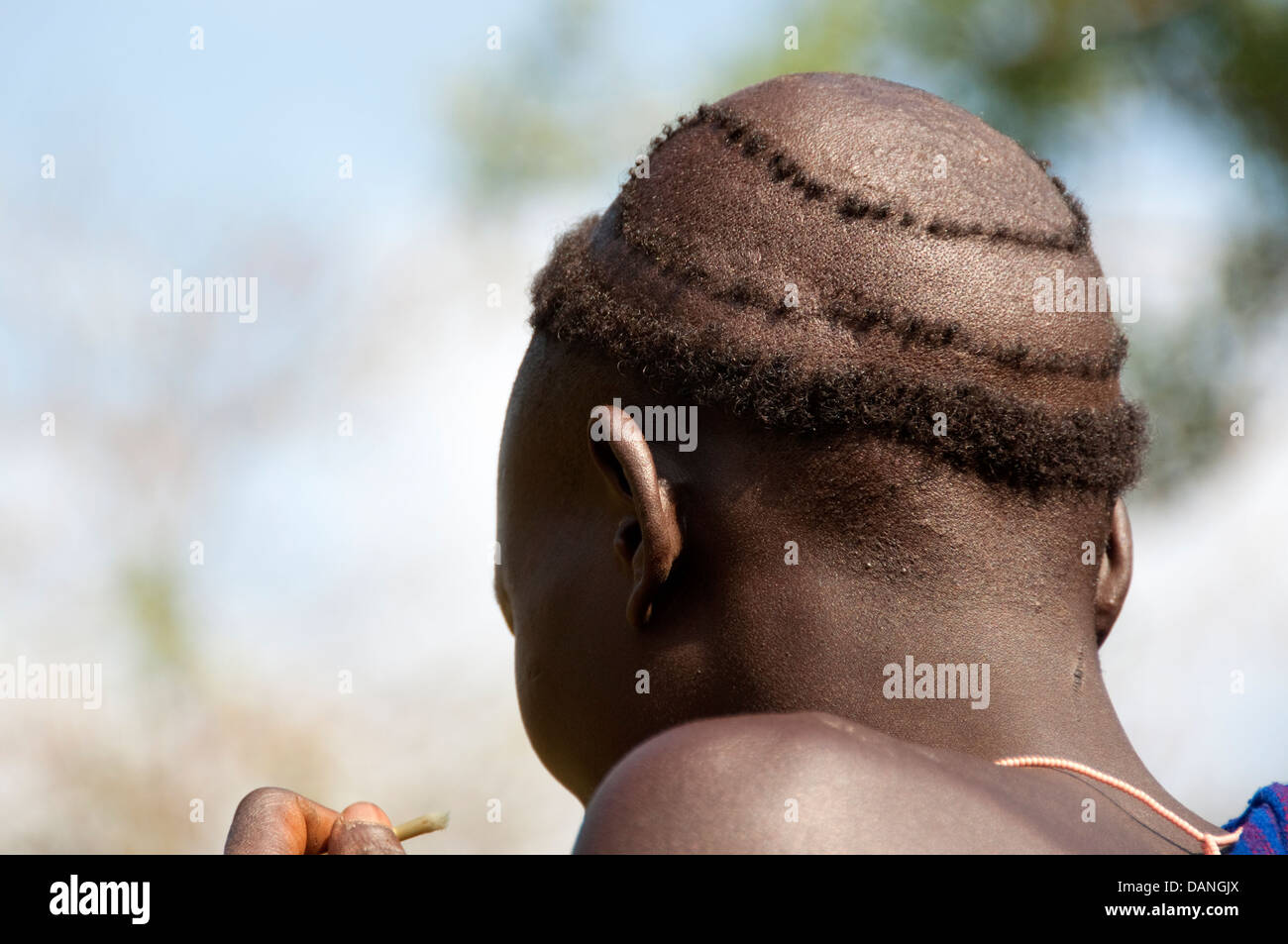 Traditional haircut of a Suri (Surma) man, Ethiopia Stock Photo