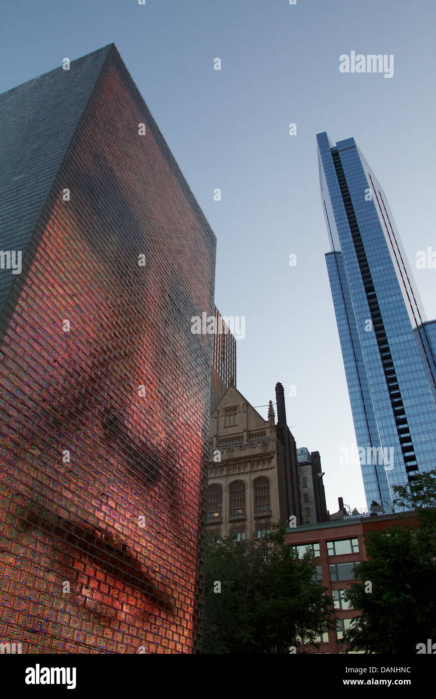 Looking up at Crown Fountain and Legacy Tower, evening. Chicago, Illinois. Designed by Jaume Plensa. Stock Photo
