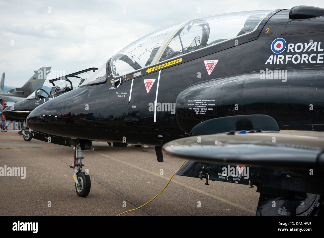 Pilots of BAE Hawk discuss on wing of airplane at Airpower 2013 airshow in Zeltweg, Austria Stock Photo