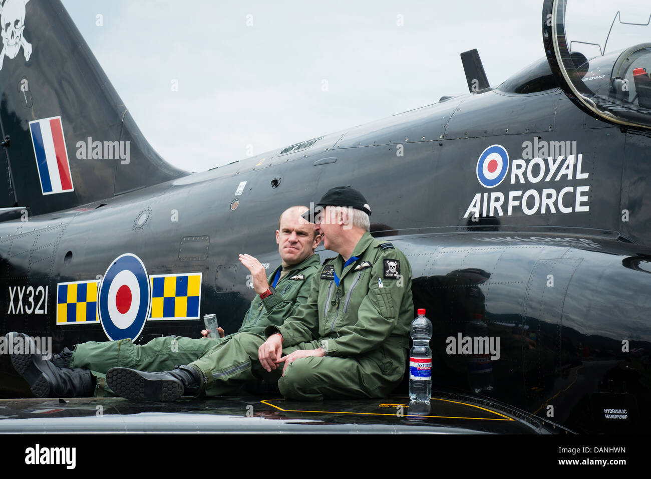 Pilots of BAE Hawk discuss on wing of airplane at Airpower 2013 airshow in Zeltweg, Austria Stock Photo