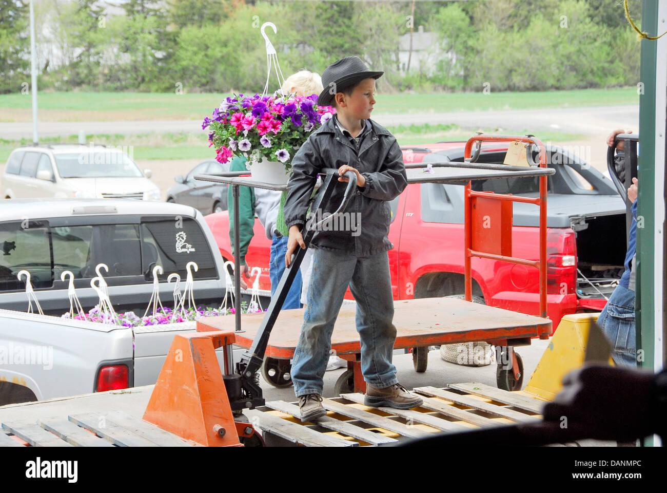 Mennonite boy at the flower auction at the Central Wisconsin Produce