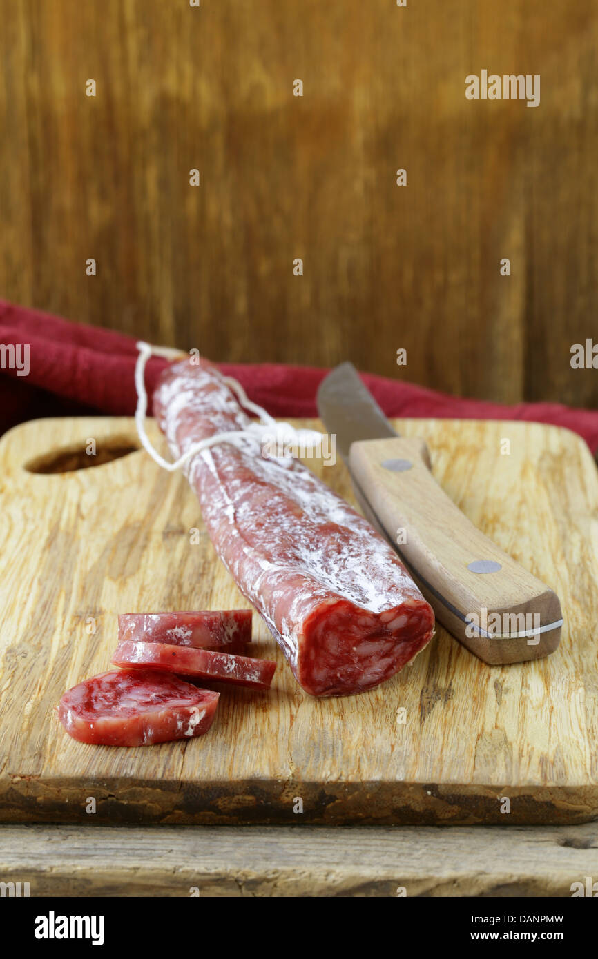 Still life of delicacy salami - rustic style Stock Photo - Alamy
