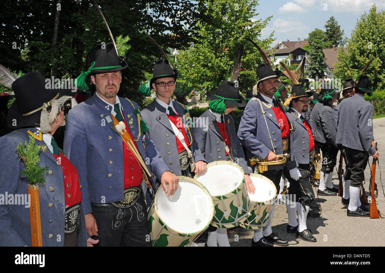 Members of a Tyrolean shooting club stand in front of the parish church of St. Pius during a requiem for Otto von Habsburg in Poecking, Germany, 09 July 2011. Otto von Habsburg, the oldest son of Charles I, the last Emperor of Austria, died on 04 July 2011 in his home in Poecking Germany surrounded by his family aged 98. Photo: URSULA DUEREN Stock Photo