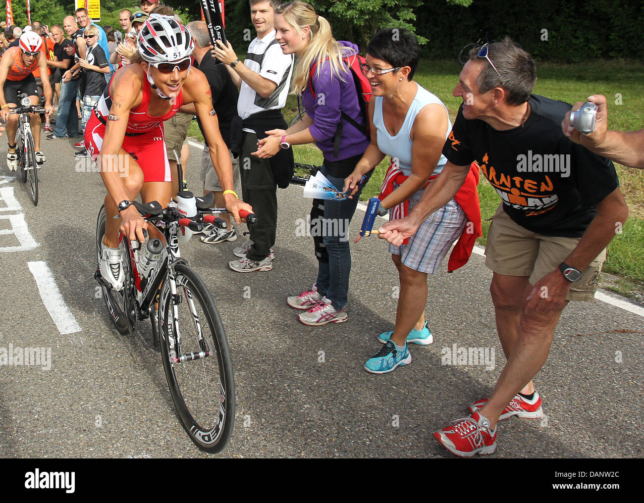 British triathlete Chrissie Wellington rides her bike during the cycling etappe of the 10th Ironman Challenge in Hipoltstein, Germany, 10 July 2011. For the ironman, the participants have to swim 3,8 km, cycle 180 km and run 42,195 km. Photo: Daniel Karmann Stock Photo