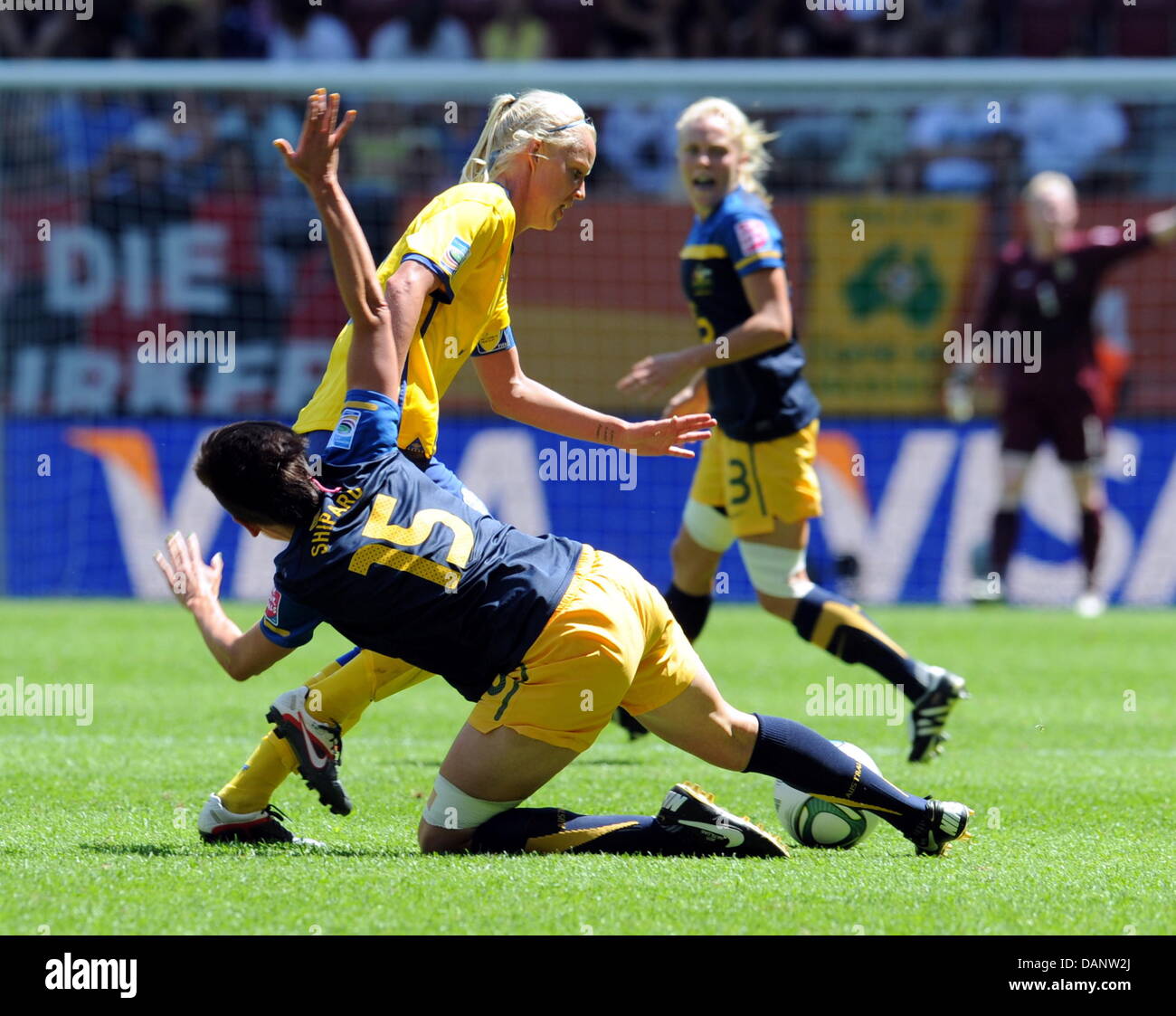 Sweden's Caroline Seger (up) and Australia's Sally Shipard vie for the ...