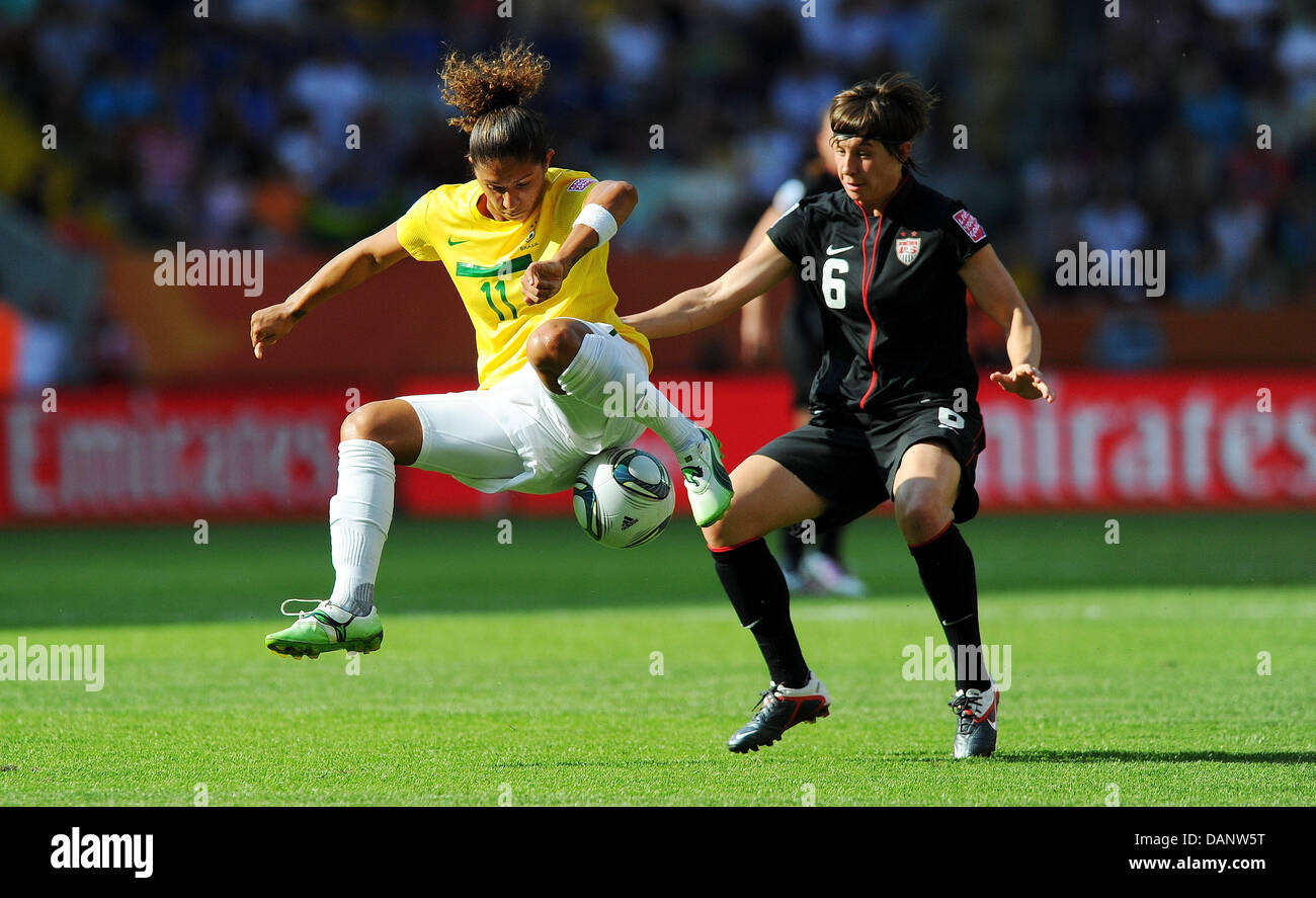 Brazil's Cristiane (L) and USA's Amy Le Peilbet fight for the ball during the quarter-final soccer match of the FIFA Women's World Cup between Brazil and the USA at the Rudolf Harbig stadium in Dresden, Germany 10 July 2011. Photo: Thomas Eisenhuth dpa  +++(c) dpa - Bildfunk+++ Stock Photo