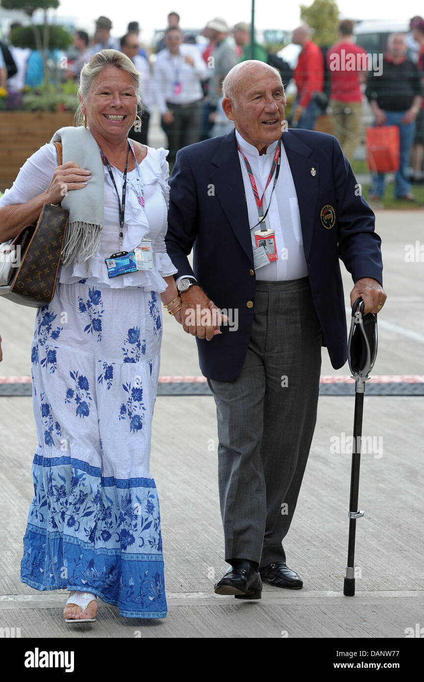 Former British Formula One driver Sir Stirling Moss (R) and his wife