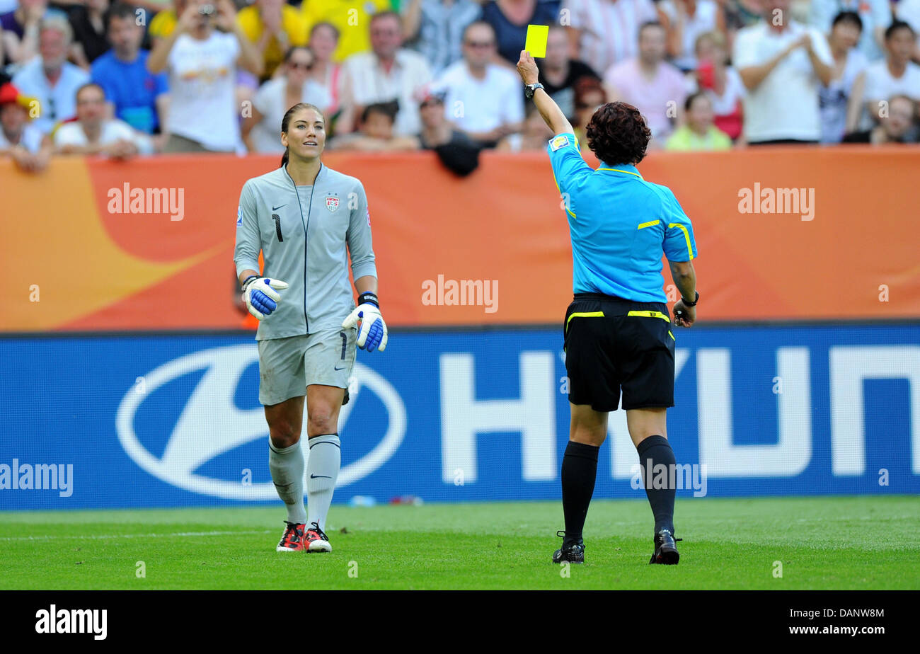 Goalkeeper Hope Solo of team USA (l) gets the yellow card from referee