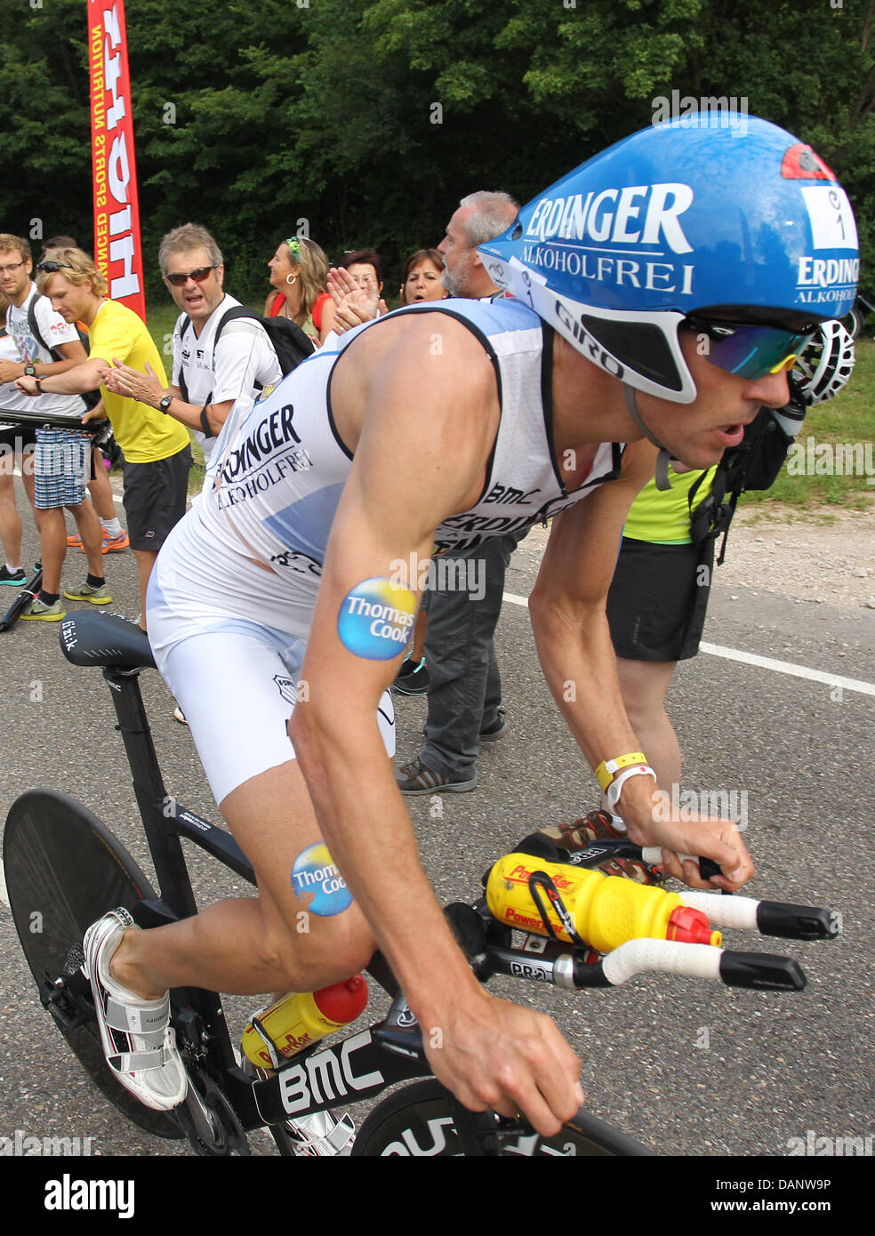 German triathlete Andreas Raelert cycles uphill during the cycling etappe of the 10th Ironman Challenge in Hipoltstein, Germany, 10 July 2011. Andreas Raelert has won first place and made a new world record. For the ironman, the participants have to swim 3,8 km, cycle 180 km and run 42,195 km. Photo: Daniel Karmann Stock Photo