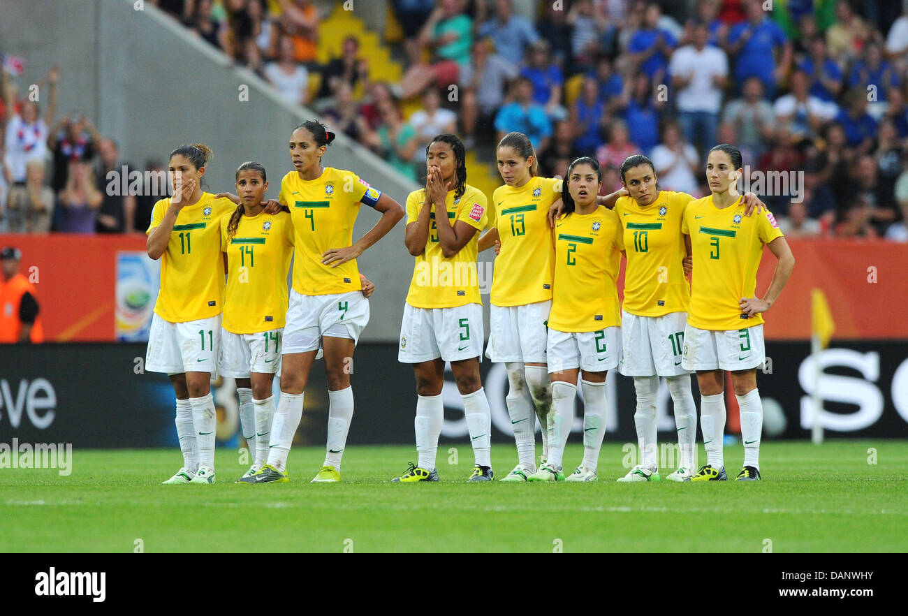 Brazil's Cristiane (L-R), Fabiana, Aline, Renata Costa, Erika, Maurine, Marta and Daiana stand together during the penalty-shootout in the quarter-final soccer match of the FIFA Women's World Cup between Brazil and the USA at the Rudolf Harbig stadium in Dresden, Germany 10 July 2011. Photo: Thomas Eisenhuth dpa Stock Photo