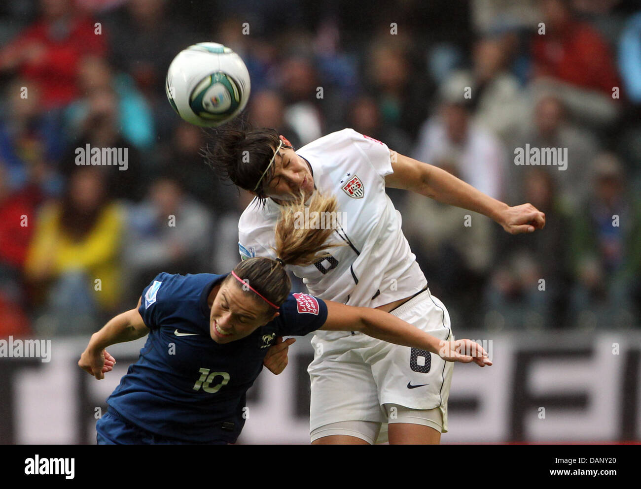 Babett Peter Of Germany  R  Makes A Turn Against Camille Abily Of France 40204372