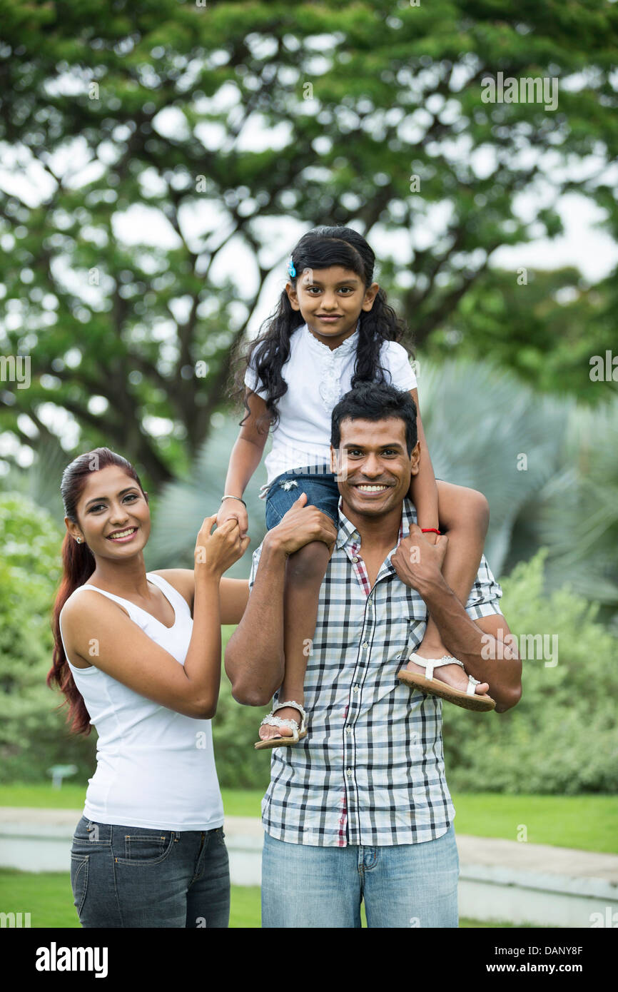 Happy Indian family. Father, mother and daughter in the park Stock