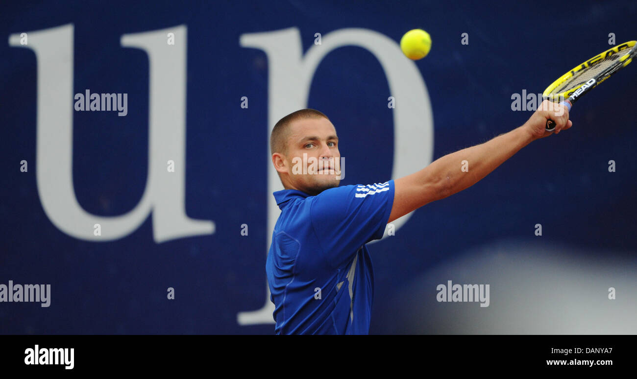 Michail Juschni from Russia hits the ball during ATP World Tour round of 16 match against Ferrero from Spain at the Tennis Club Weissenhof in Stuttgart, Germany, 14 July 2011. Photo: Marijan Murat Stock Photo
