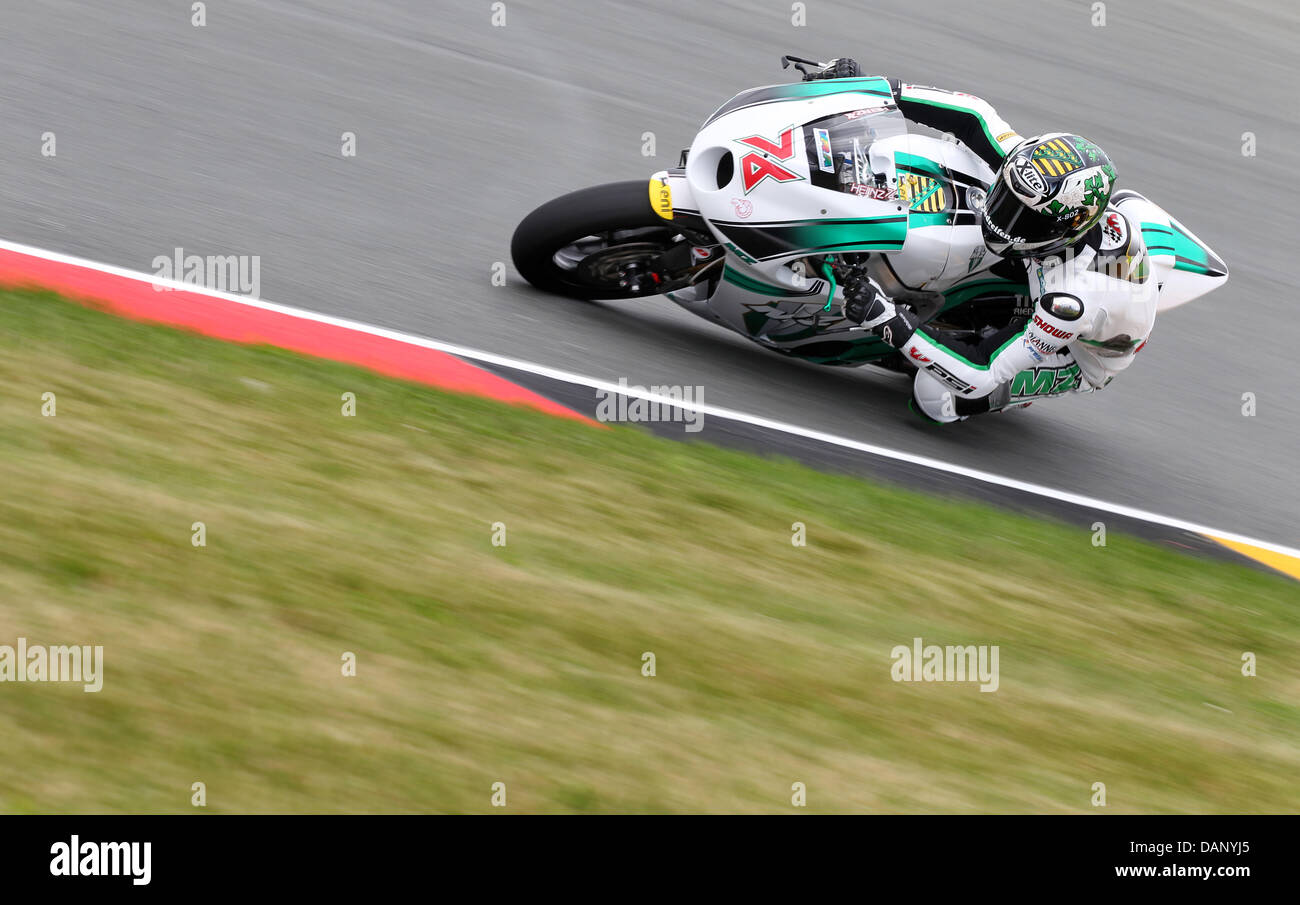 German MZ pilot Max Neukirchner steers his motorcycle along the Sachsenring race track during a training session of the Moto2 class for the German Grand Prix in Hohenstein-Ernstthal, Germany, 15 July 2011. The MotoGP, the premier class of the Road Racing World Championship Grand Prix, also starts at the Sachsenring on 17 July 2011. Photo: Jan Woitas Stock Photo