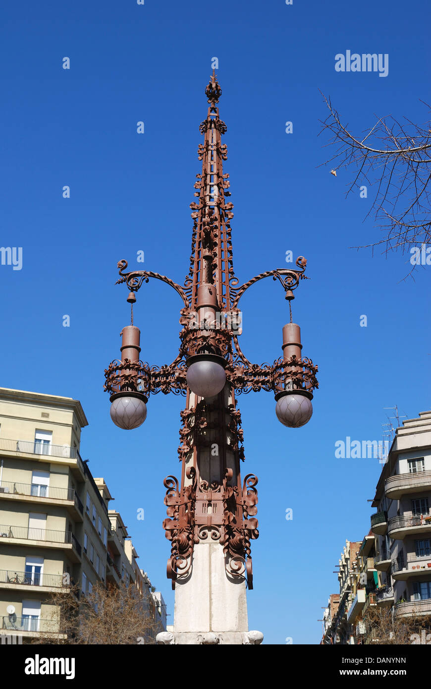 Highly decorated ornate wrought iron street lamp in Barcelona