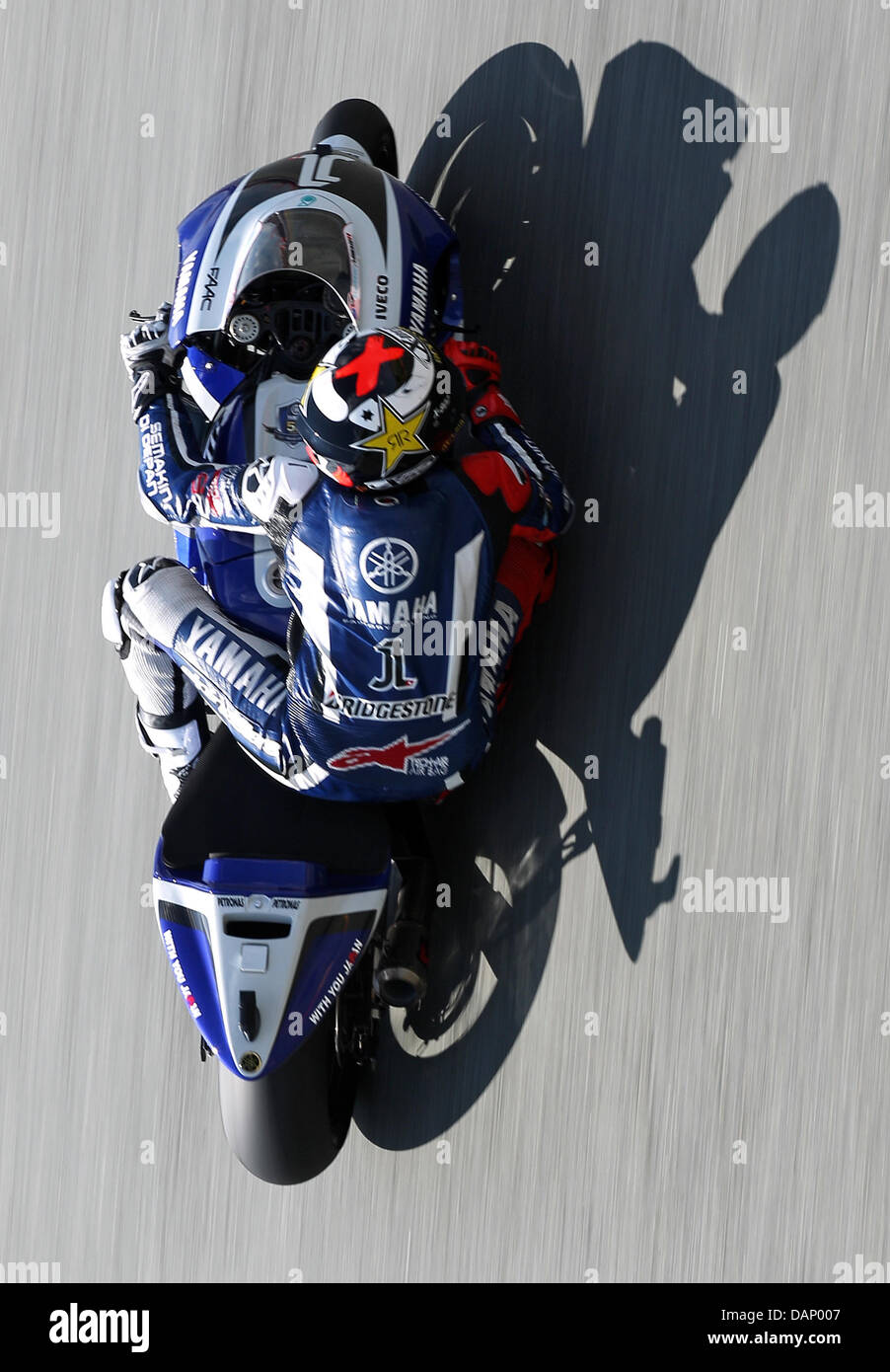 The Spanish Yamaha driver Jorge Lorenzo  drives his motorcycle in a MotoGP race training on the Sachsenring circuit in Hohenstein-Ernstthal, Germany, 16 July 2011. Photo: Jan Woitas Stock Photo