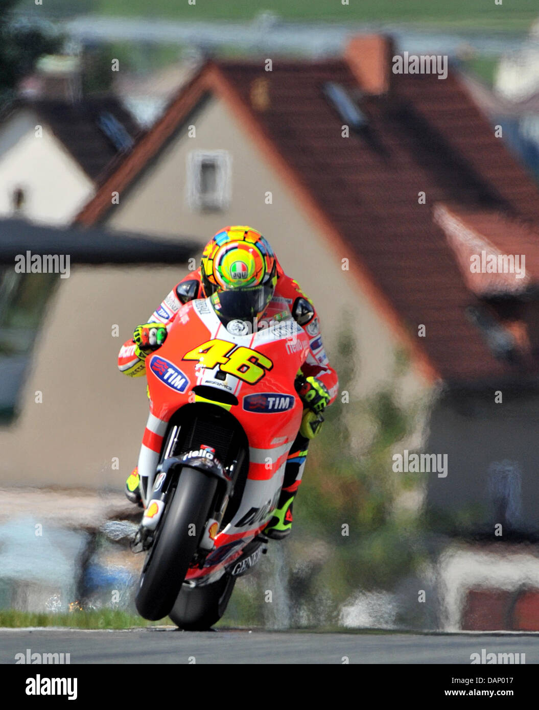 The Italian Ducati driver Valentino Rossi drives his motorcycle in a MotoGP race training on the Sachsenring circuit in Hohenstein-Ernstthal, Germany, 16 July 2011. Photo: Jan Woitas Stock Photo